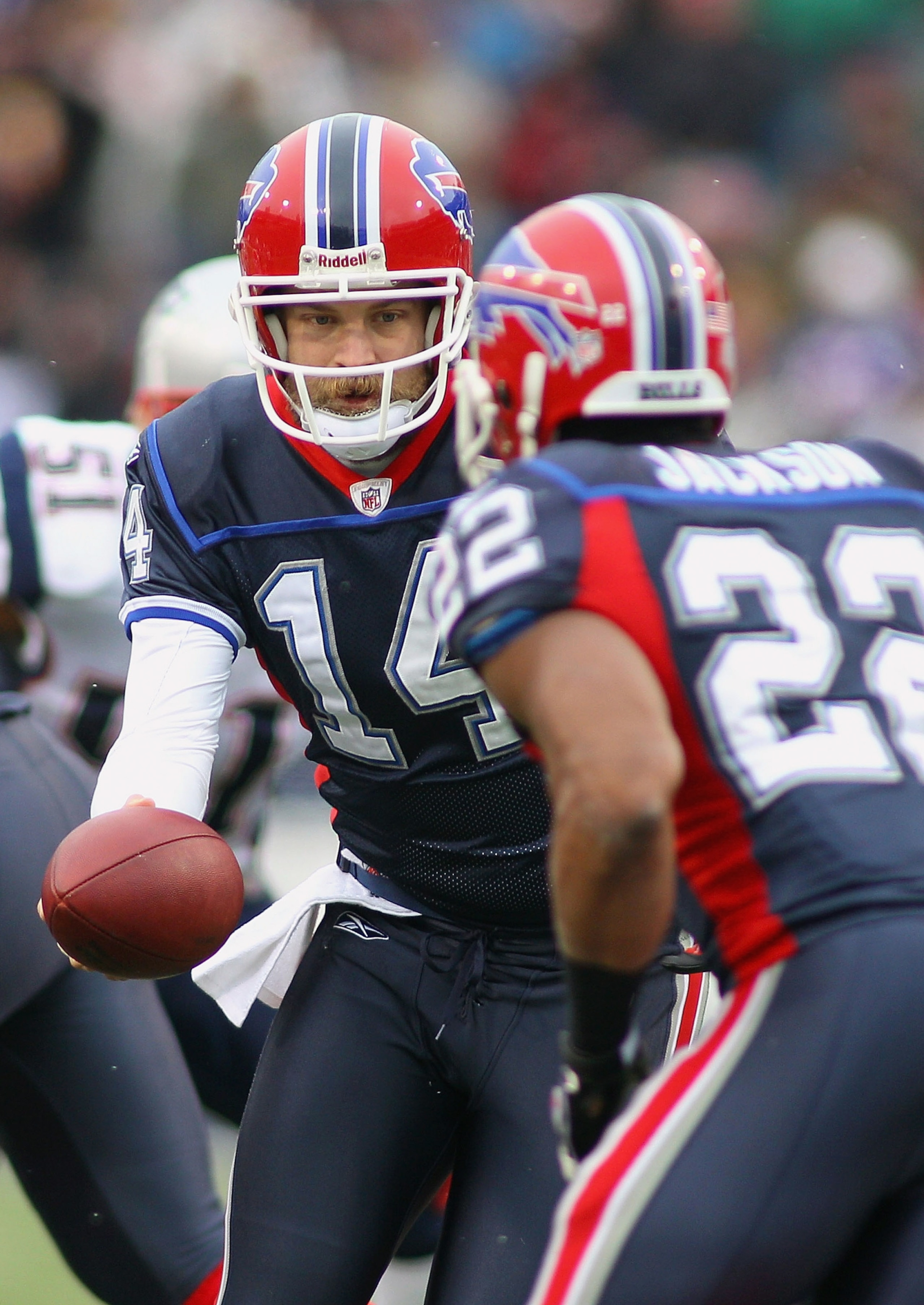 ORCHARD PARK, NY - DECEMBER 26:  Ryan Fitzpatrick #14  of the Buffalo Bills hands off to Fred Jackson #22 in a match against the New England Patriots at Ralph Wilson Stadium on December 26, 2010 in Orchard Park, New York.  (Photo by Rick Stewart/Getty Ima
