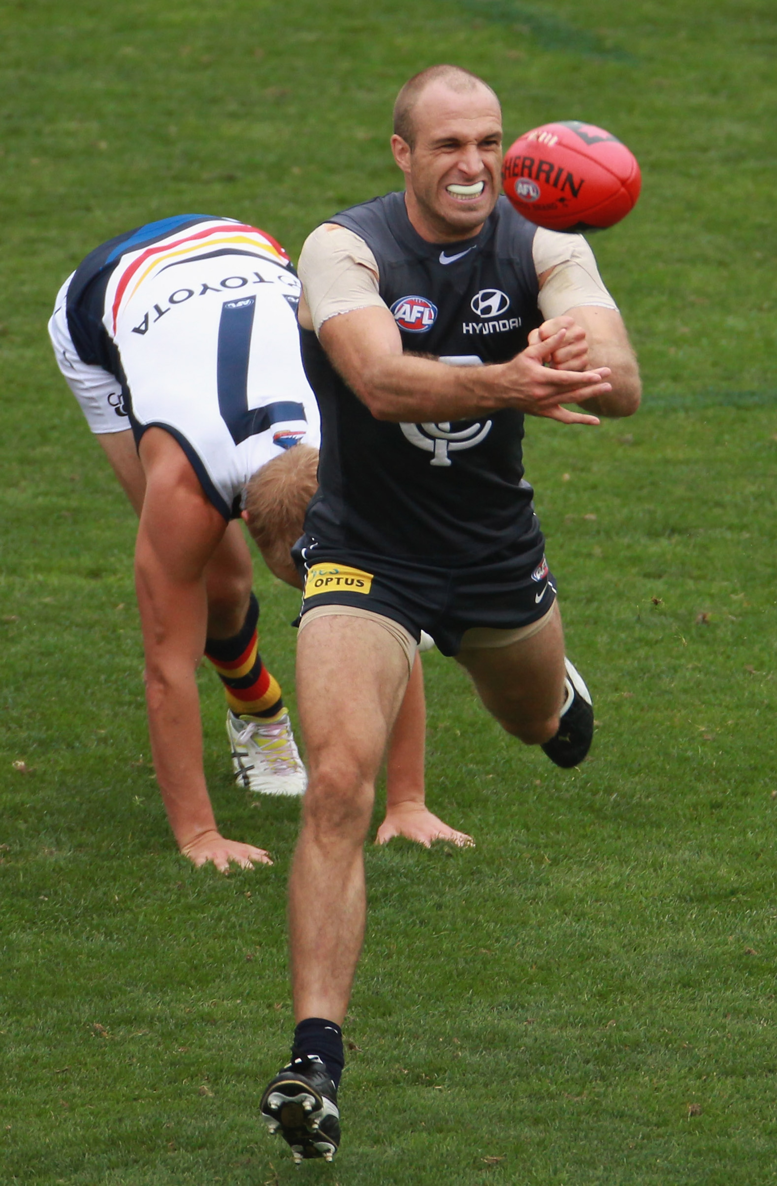 MELBOURNE, AUSTRALIA - MARCH 04: Chris Judd of the Blues handballs during the NAB Challenge AFL match between the Carlton Blues and the Adelaide Crows at Visy Park on March 4, 2011 in Melbourne, Australia. (Photo by Robert Cianflone/Getty Images) MELBOURNE, AUSTRALIA - MARCH 04: Chris Judd of the Blues handballs during the NAB Challenge AFL match between the Carlton Blues and the Adelaide Crows at Visy Park on March 4, 2011 in Melbourne, Australia. (Photo by Robert Cianflone/Getty Images)