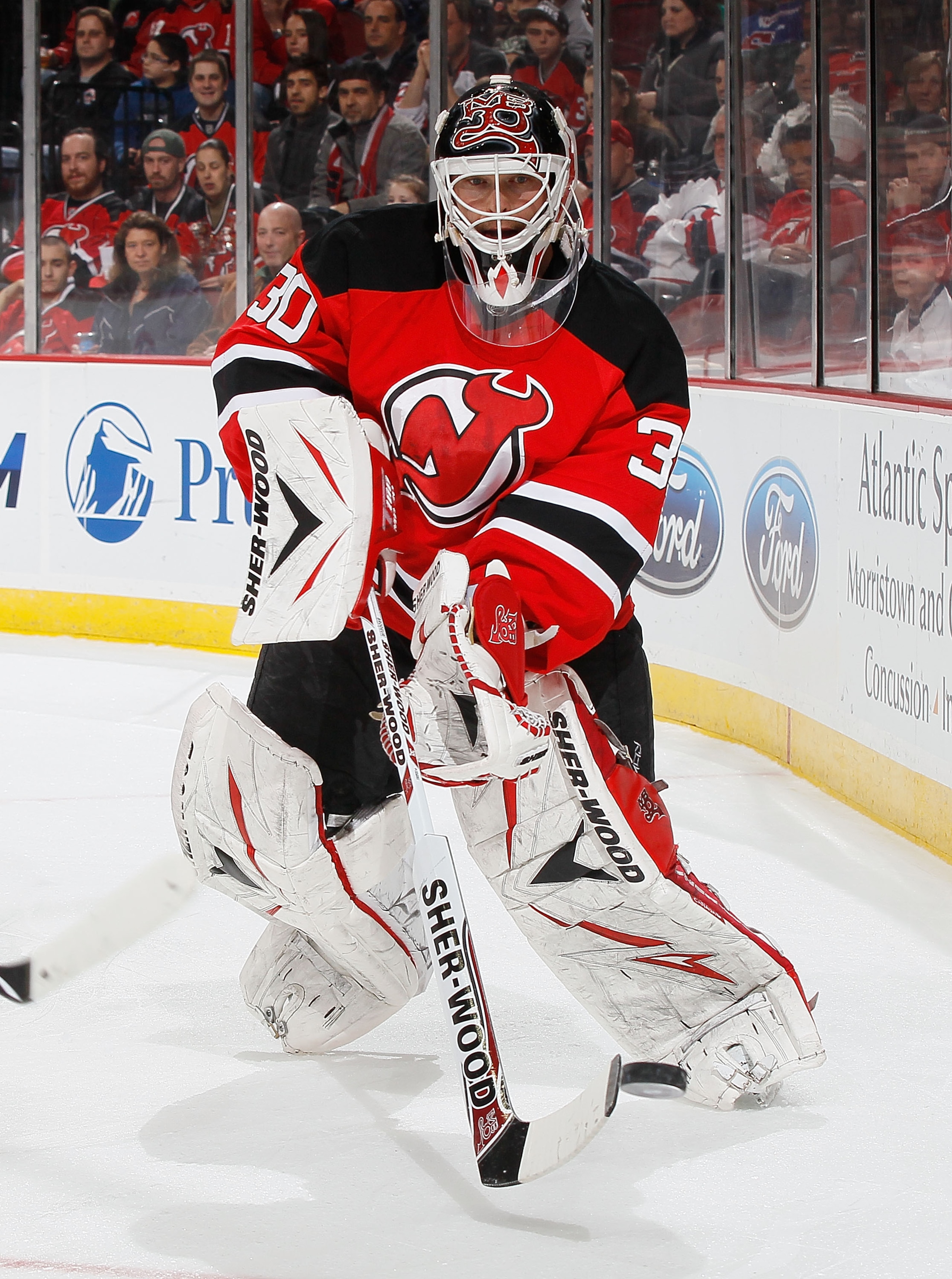 NEWARK, NJ - MARCH 12: Goaltender Martin Brodeur #30 of the New Jersey Devils clears the puck behind the net against the New York Islanders on March 12, 2011 at the Prudential Center in Newark, New Jersey. Devisl defeated the Islanders 3-2 in OT. (Photo NEWARK, NJ - MARCH 12: Goaltender Martin Brodeur #30 of the New Jersey Devils clears the puck behind the net against the New York Islanders on March 12, 2011 at the Prudential Center in Newark, New Jersey. Devisl defeated the Islanders 3-2 in OT. (Photo