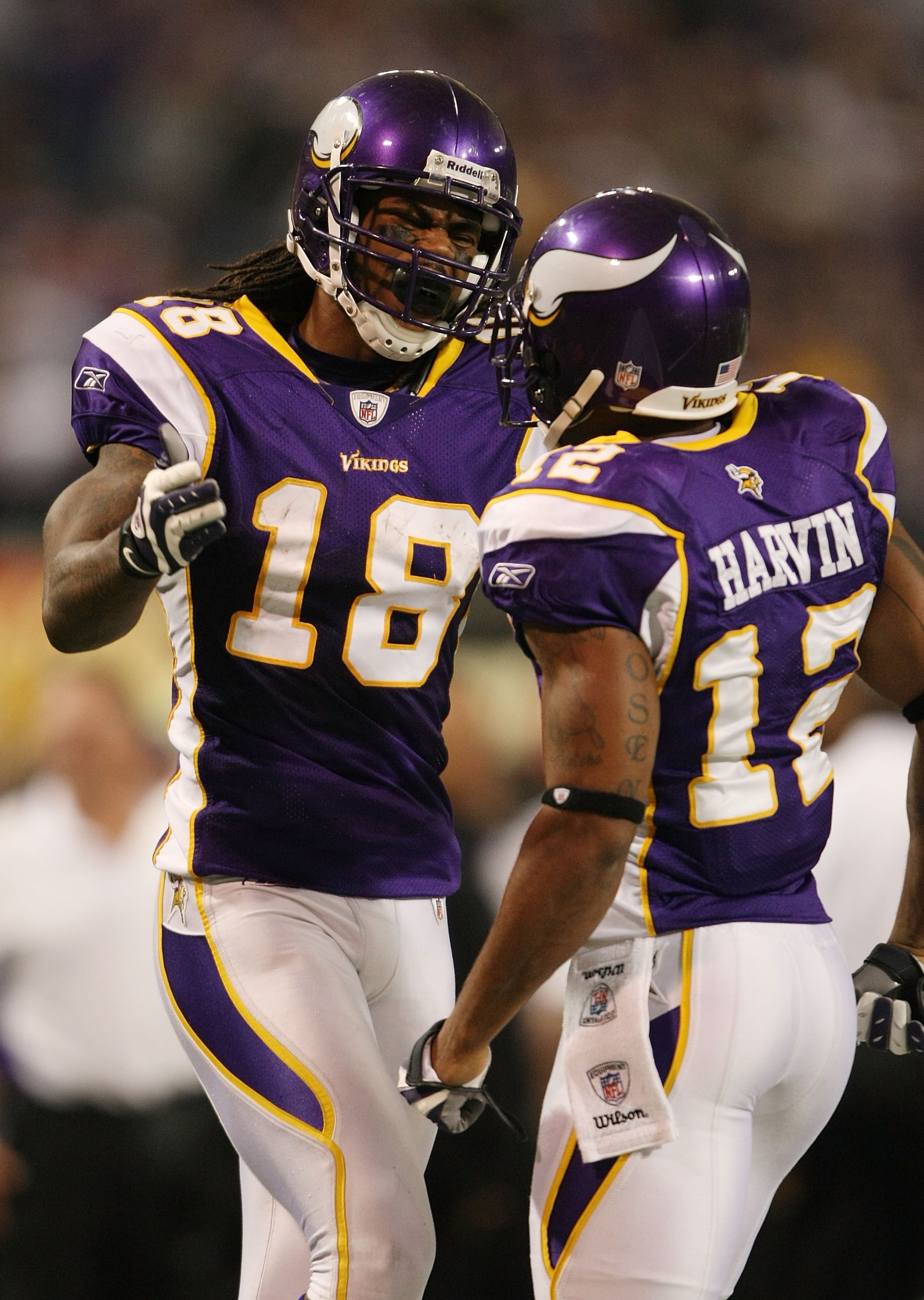 MINNEAPOLIS - NOVEMBER 15: Sidney Rice #18 of the Minnesota Vikings congratulates teammate Percy Harvin #12 after Harvin made a 40 yard run in the fourth quarter against the Detroit Lions on November 15, 2009 at Hubert H. Humphrey Metrodome in Minneapolis