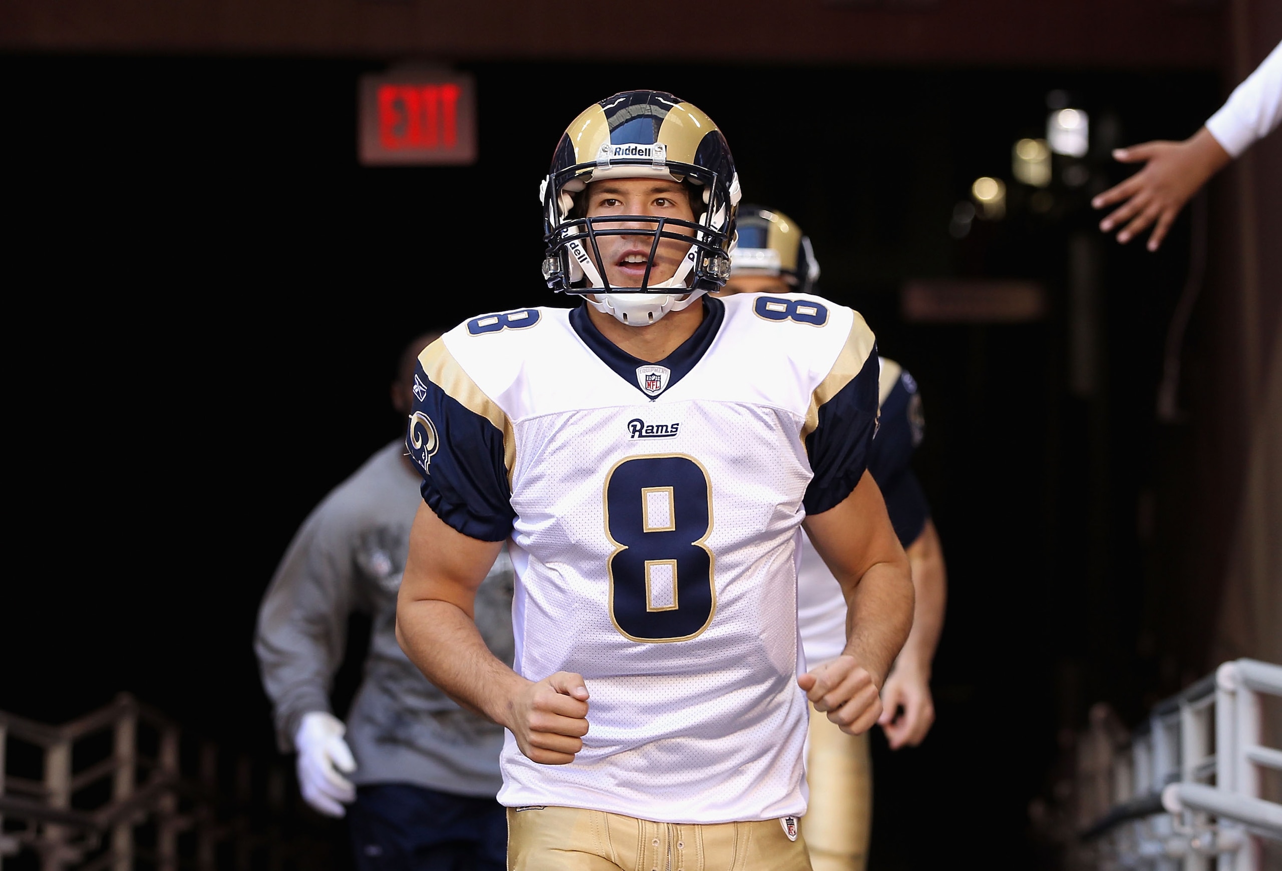 GLENDALE, AZ - DECEMBER 05:  Quarterback Sam Bradford #8 of the St. Louis Rams runs out onto the field before the NFL game against the Arizona Cardinals at the University of Phoenix Stadium on December 5, 2010 in Glendale, Arizona. The Rams defeated the C