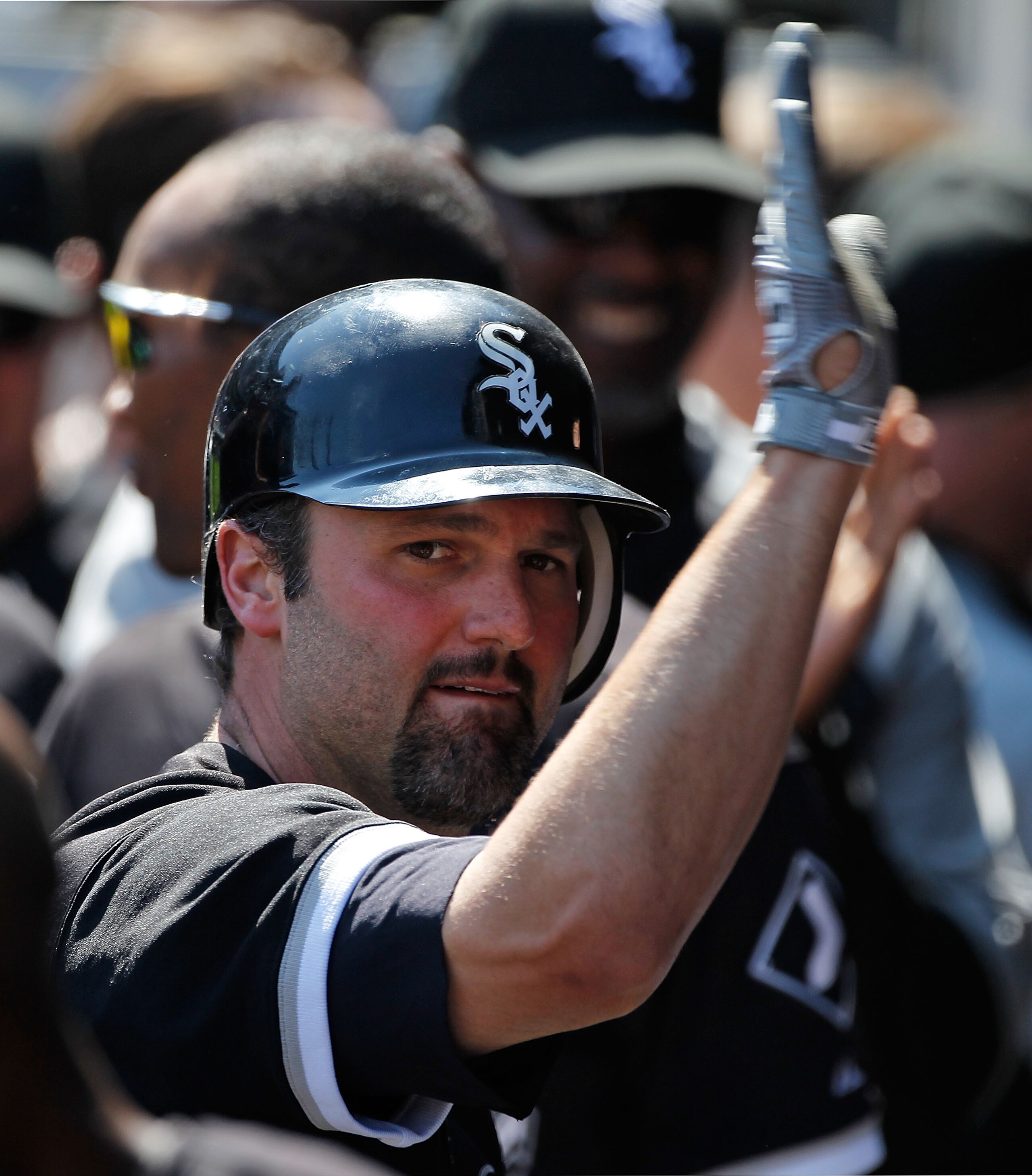 CHICAGO - JUNE 24: Paul Konerko #14 of the Chicago White Sox is greeted by teammates in the dugout after hitting the game winning home run, a two-run shot in the 8th inning, against the Atlanta Braves at U.S. Cellular Field on June 24, 2010 in Chicago, Il