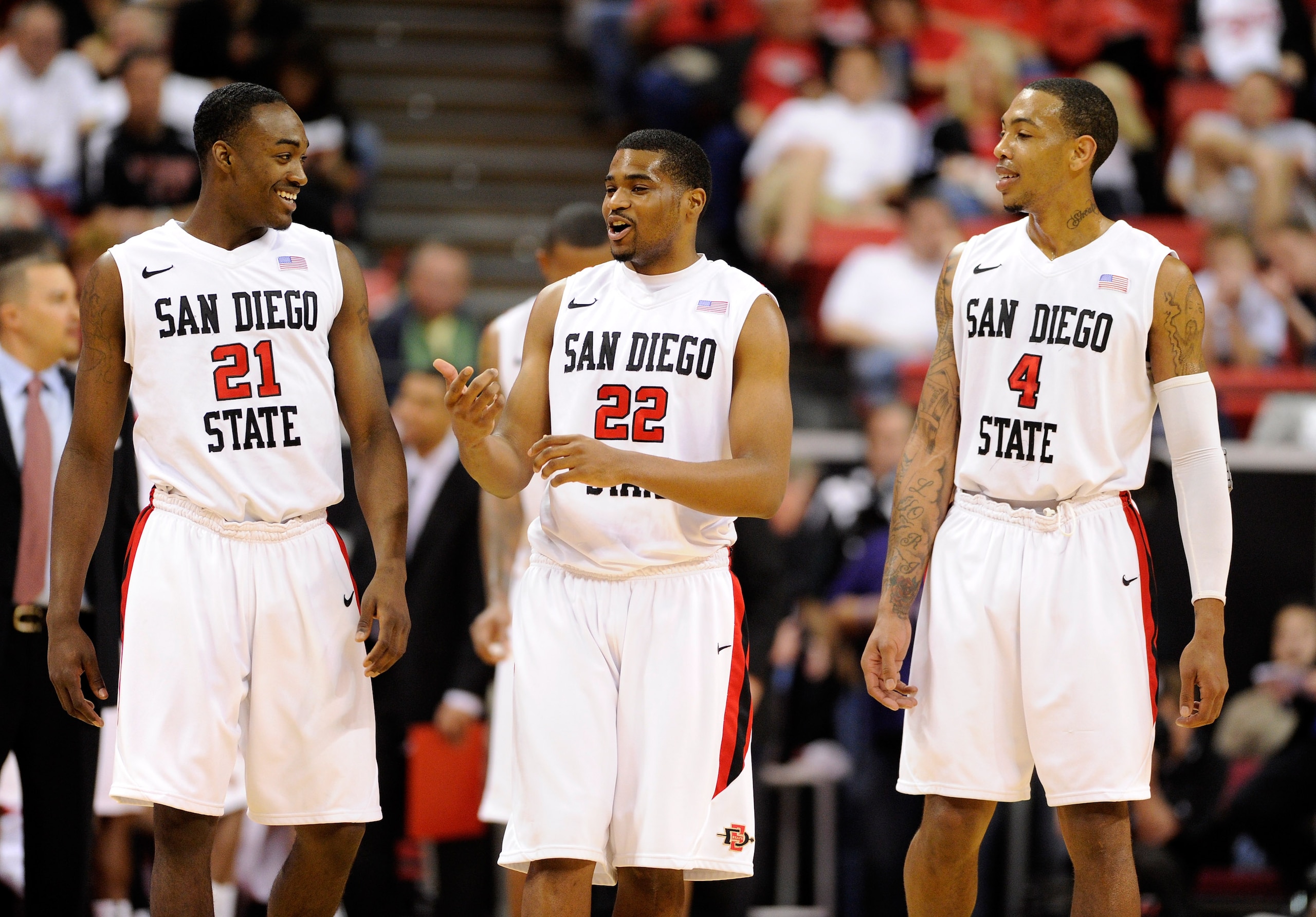LAS VEGAS, NV - MARCH 10:  Jamaal Franklin #21, Chase Tapley #22 and Malcolm Thomas #4 of the San Diego State Aztecs share a laugh during a quarterfinal game of the Conoco Mountain West Conference Basketball tournament against the Utah Utes at the Thomas