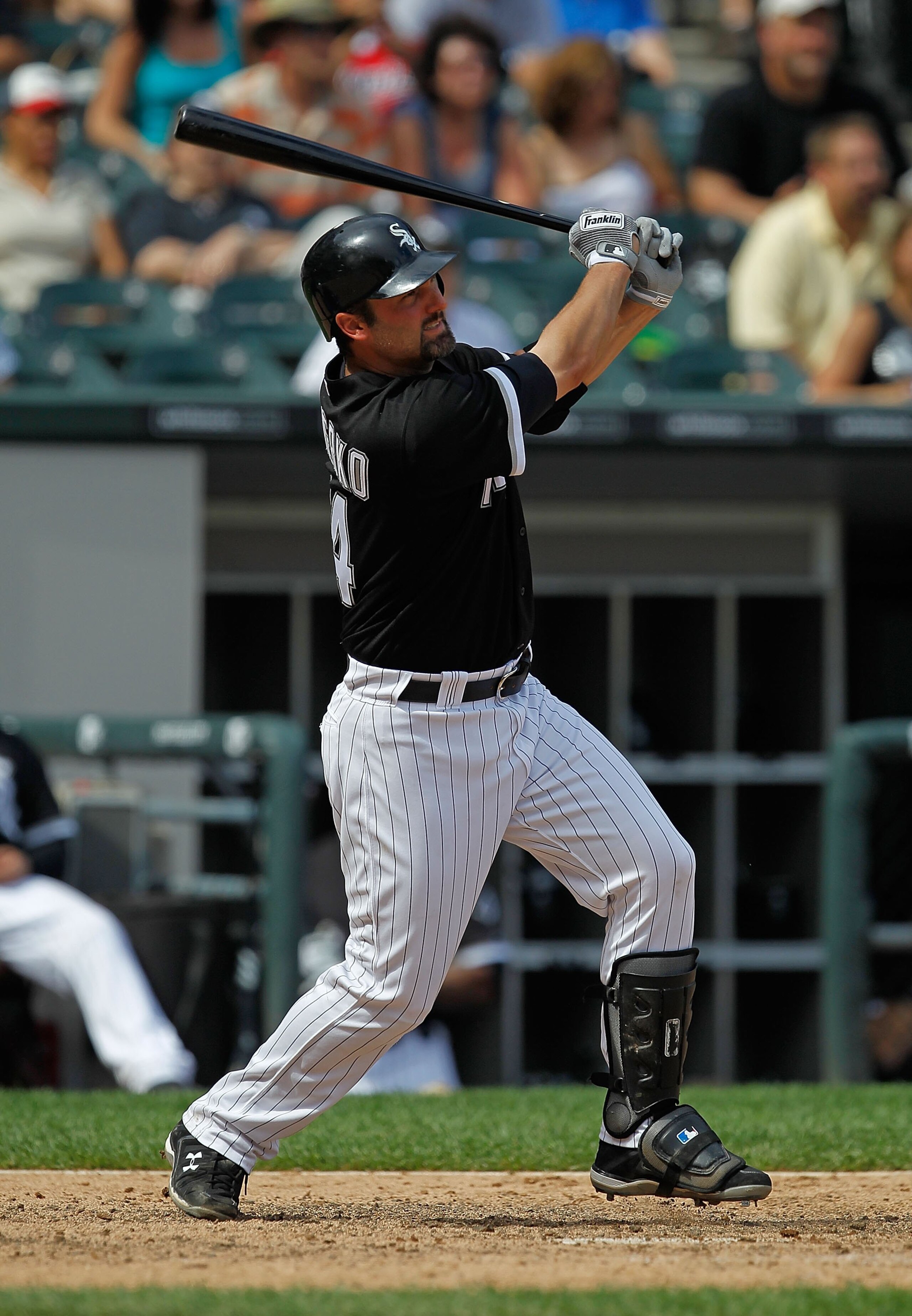 CHICAGO - JUNE 27: Paul Konerko #14 of the Chicago White Sox takes a swing against the Chicago Cubs at U.S. Cellular Field on June 27, 2010 in Chicago, Illinois. The Cubs defeated the White Sox 8-6. (Photo by Jonathan Daniel/Getty Images)