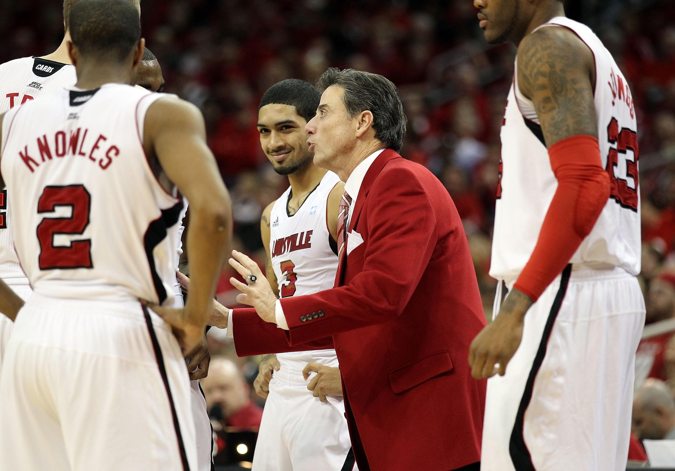 LOUISVILLE, KY - MARCH 02:  Rick Pitino the Head Coach of the Louisville Cardinals gives instructions to his team during the Big East Conference game against the Providence Friars at the KFC Yum! Center on March 2, 2011 in Louisville, Kentucky.  (Photo by