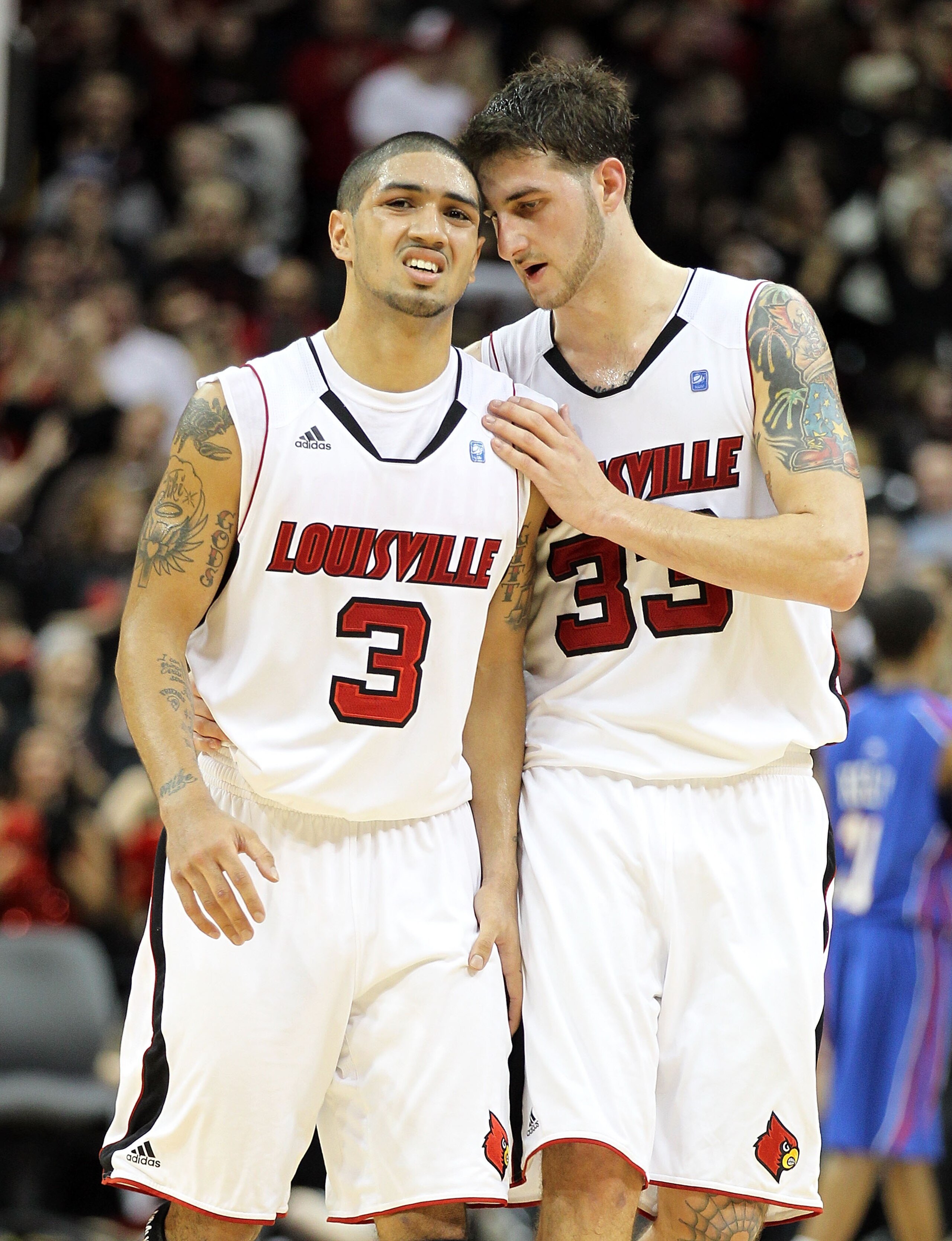 LOUISVILLE, KY - FEBRUARY 05:  Peyton Siva #3 and Mike Marra #33 of the Louisville Cardinals celebrate during the Big East Conference game against the DePaul Blue Demons at the KFC Yum! Center on February 5, 2011 in Louisville, Kentucky.  Louisville won 6