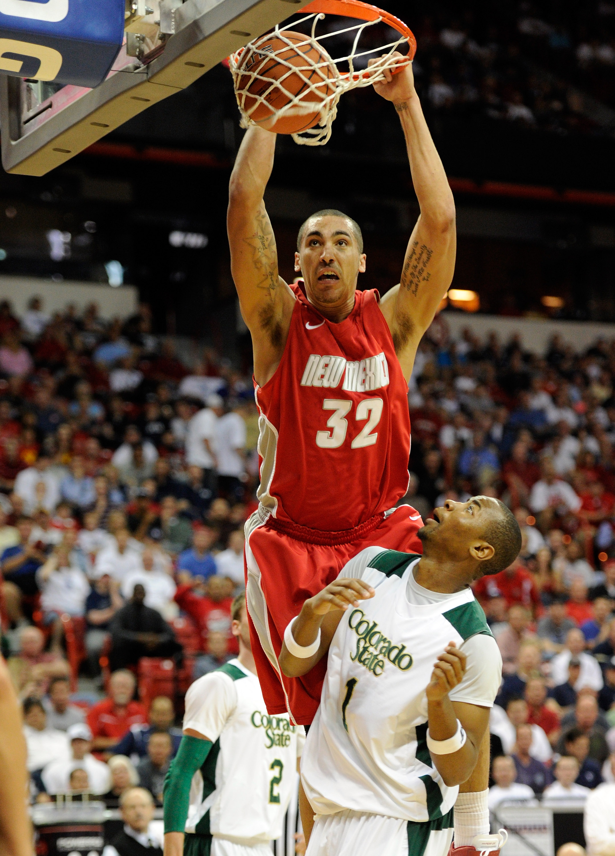 LAS VEGAS, NV - MARCH 10: Drew Gordon #32 of the New Mexico Lobos dunks over Travis Franklin #1 of the Colorado State Rams during a quarterfinal game of the Conoco Mountain West Conference Basketball tournament at the Thomas & Mack Center March 10, 2011