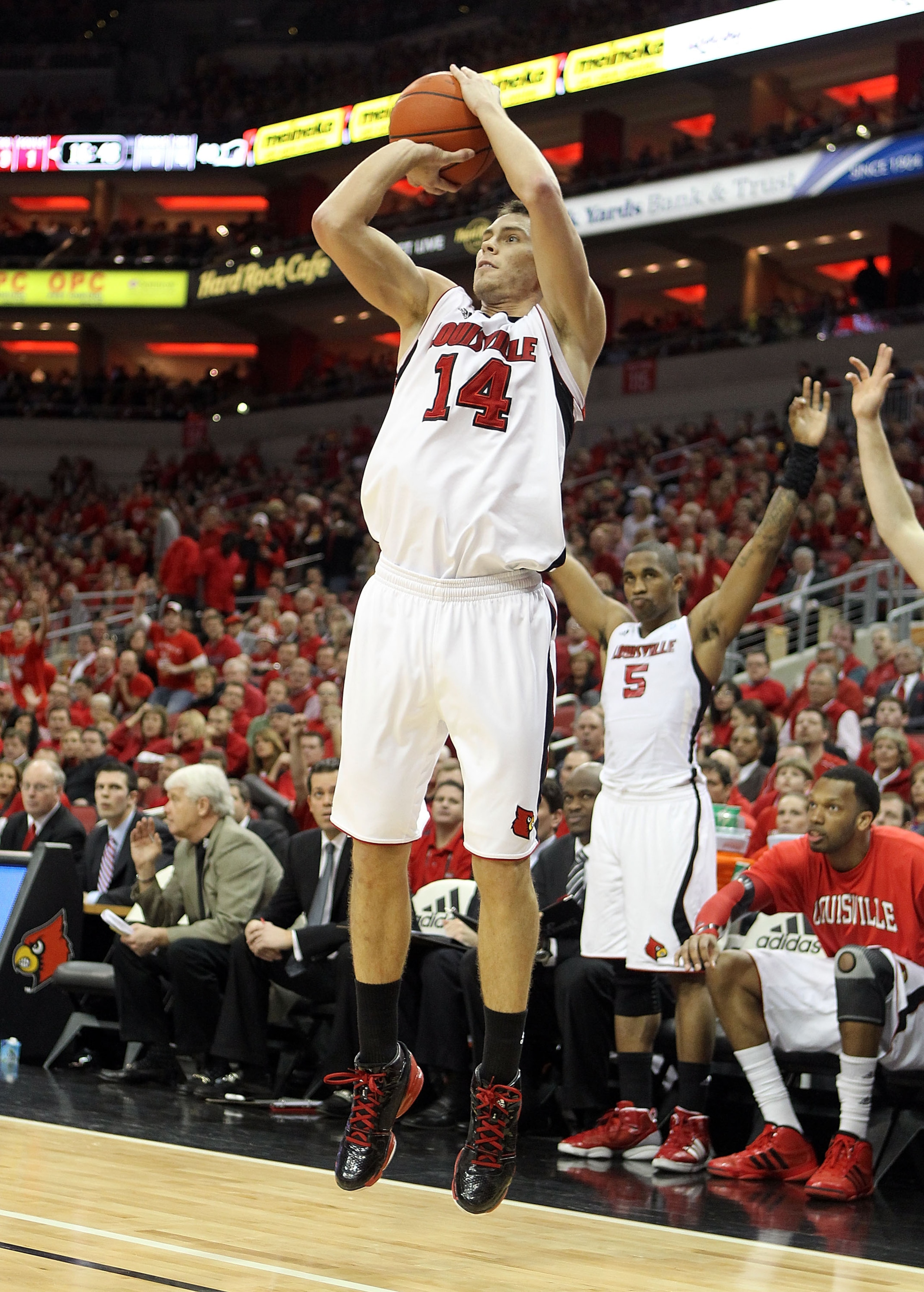 LOUISVILLE, KY - MARCH 02:  Kyle Kuric #14 of the Louisville Cardinals shoots the ball during the Big East Conference game against the Providence Friars at the KFC Yum! Center on March 2, 2011 in Louisville, Kentucky. Louisville won 87-60.  (Photo by Andy
