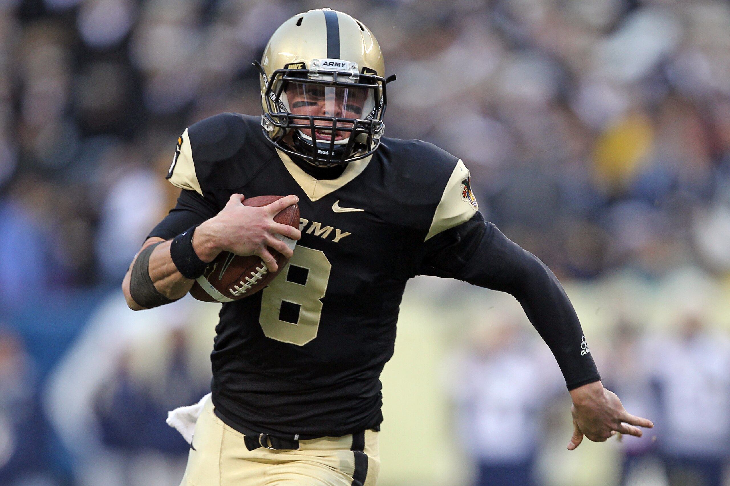 PHILADELPHIA - DECEMBER 11: Quarterback Trent Steelman #8 of the Army Black Knights runs with the ball during the game against the Navy Midshipmen on December 11, 2010 at Lincoln Financial Field in Philadelphia, Pennsylvania. The Midshipmen won 31-17. (Ph