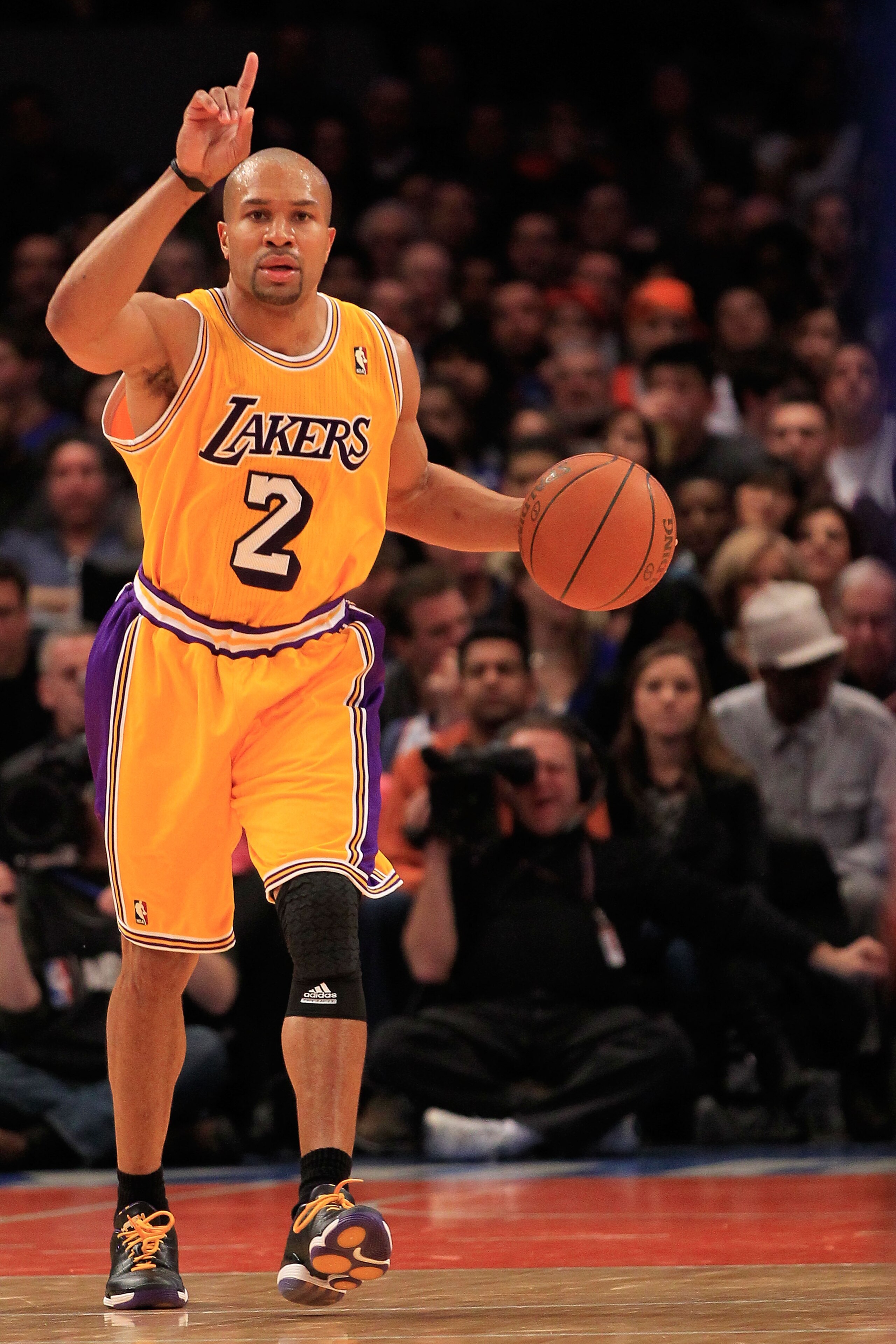 NEW YORK, NY - FEBRUARY 11: Derek Fisher #2 of the Los Angeles Lakers dribbles the ball against the New York Knicks at Madison Square Garden on February 11, 2011 in New York City. NOTE TO USER: User expressly acknowledges and agrees that, by downloading a
