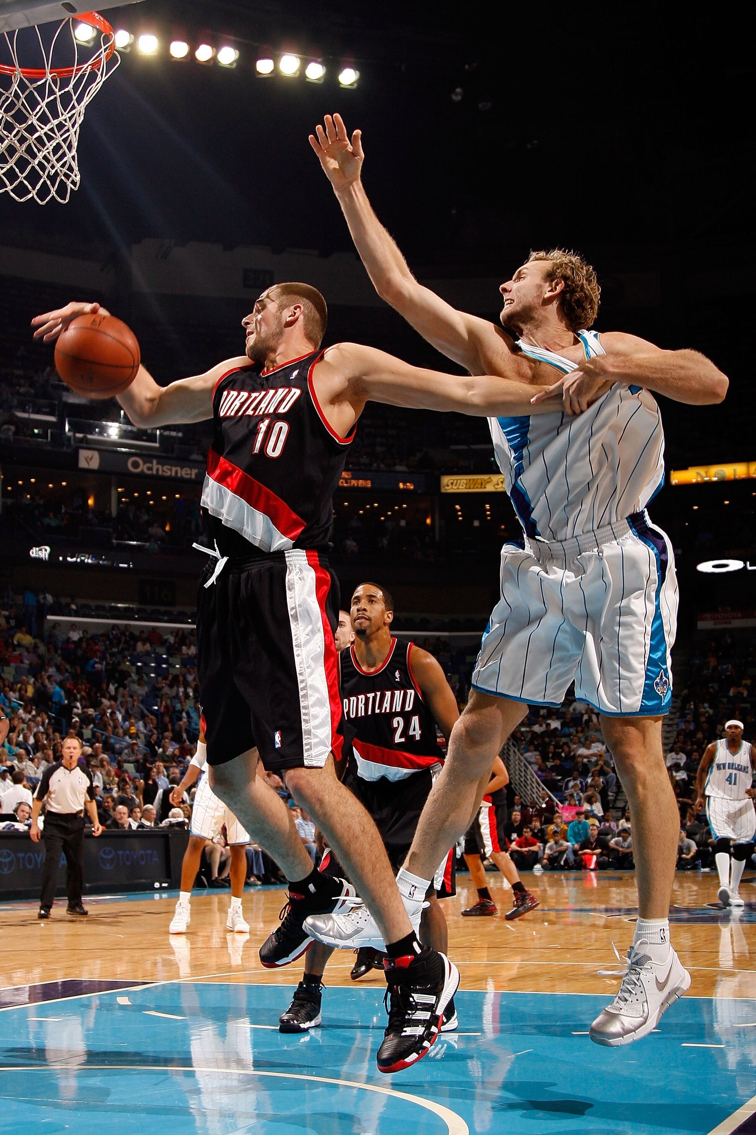 NEW ORLEANS - NOVEMBER 13: Joel Przybilla #10 of the Portland Trail Blazers fights for a rebound with Sean Marks #4 of the New Orleans Hornets at the New Orleans Arena on November 13, 2009 in New Orleans, Louisiana. NOTE TO USER: User expressly acknowle NEW ORLEANS - NOVEMBER 13: Joel Przybilla #10 of the Portland Trail Blazers fights for a rebound with Sean Marks #4 of the New Orleans Hornets at the New Orleans Arena on November 13, 2009 in New Orleans, Louisiana. NOTE TO USER: User expressly acknowle