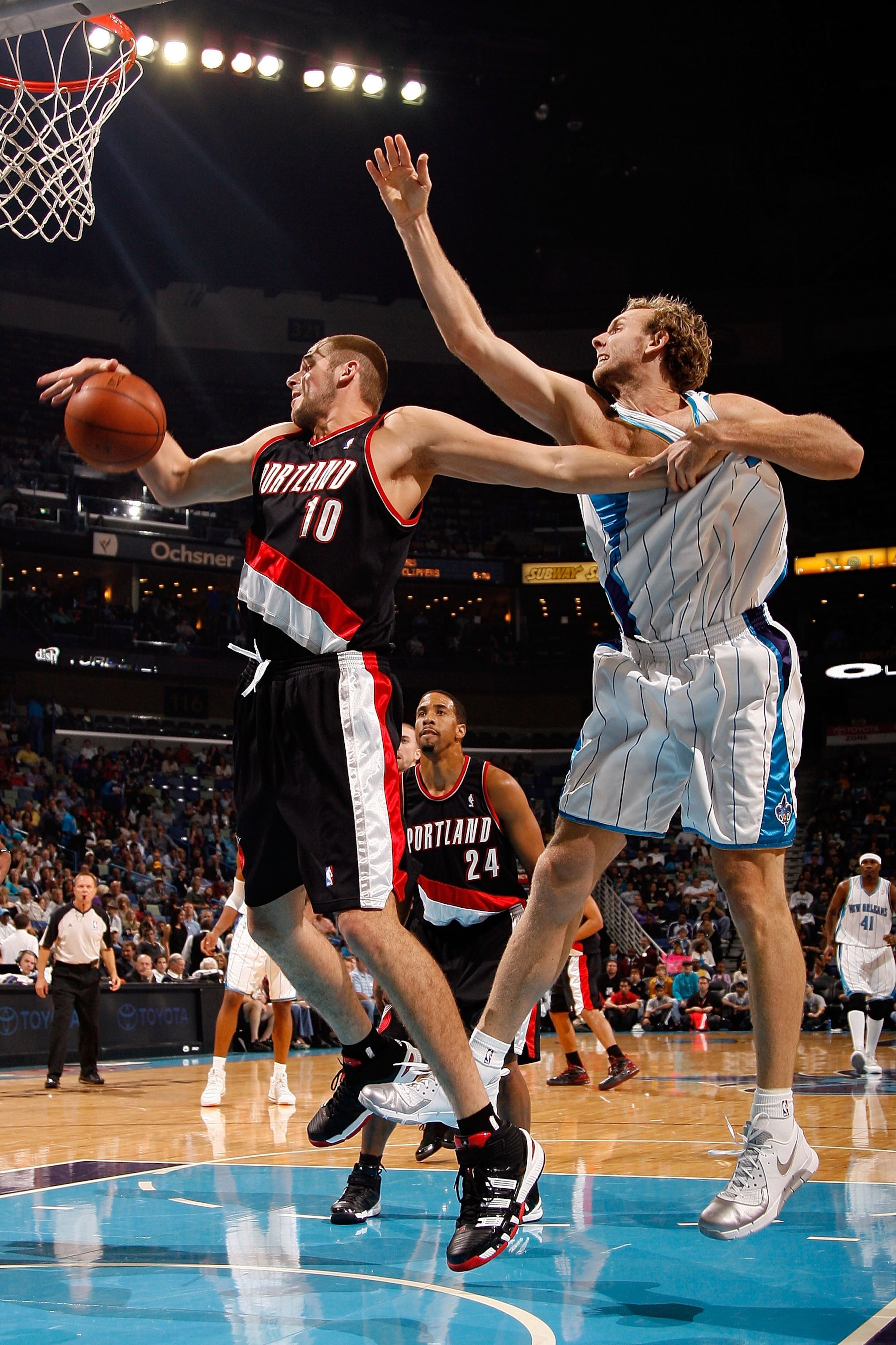 NEW ORLEANS - NOVEMBER 13:  Joel Przybilla #10 of the Portland Trail Blazers fights for a rebound with Sean Marks #4 of the New Orleans Hornets at the New Orleans Arena on November 13, 2009 in New Orleans, Louisiana.  NOTE TO USER: User expressly acknowle