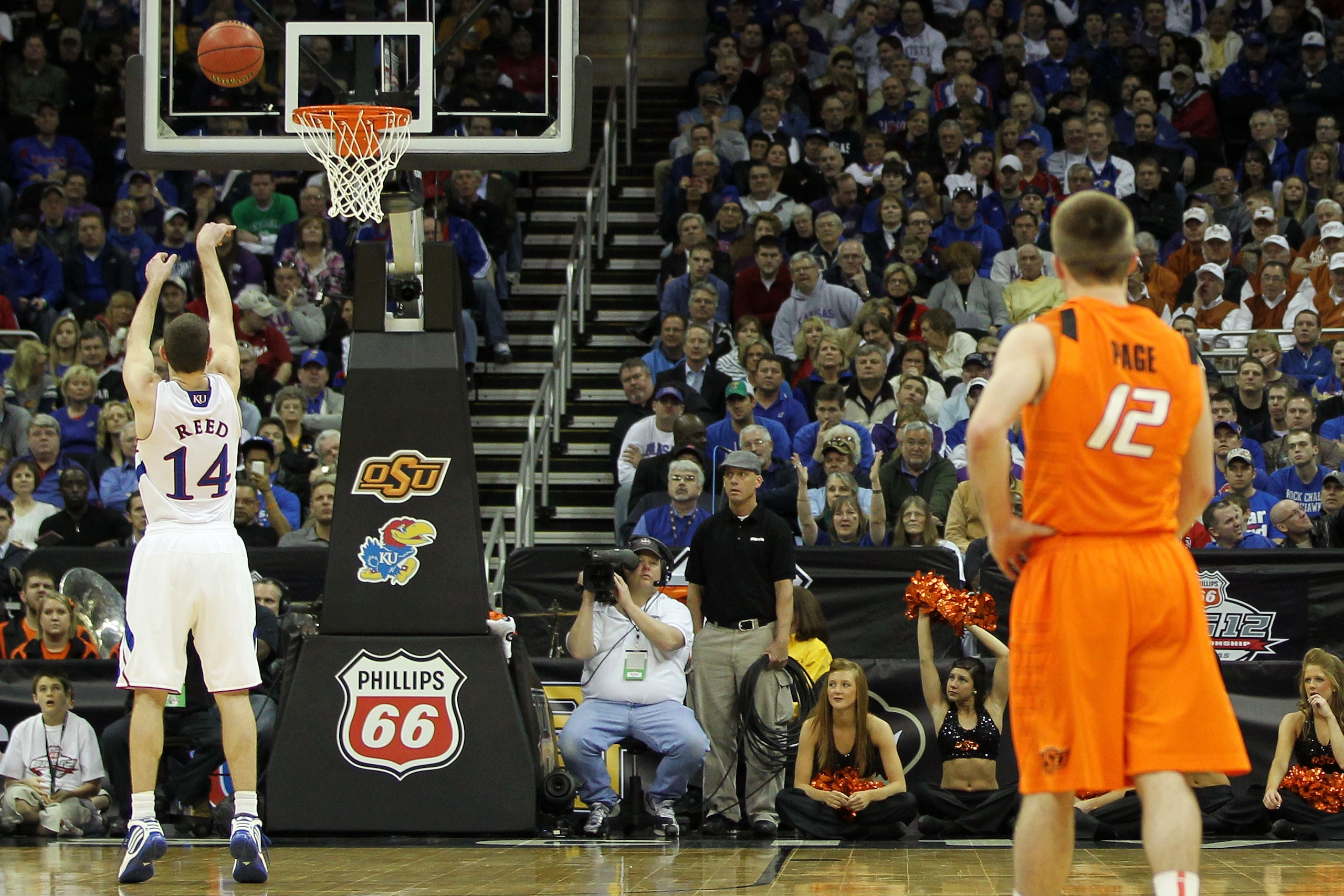 KANSAS CITY, MO - MARCH 10:  Tyrel Reed #14 of the Kansas Jayhawks shoots a free throw after a technical foul by the Oklahoma State Cowboys during their quarterfinal game in the 2011 Phillips 66 Big 12 Men's Basketball Tournament at Sprint Center on March