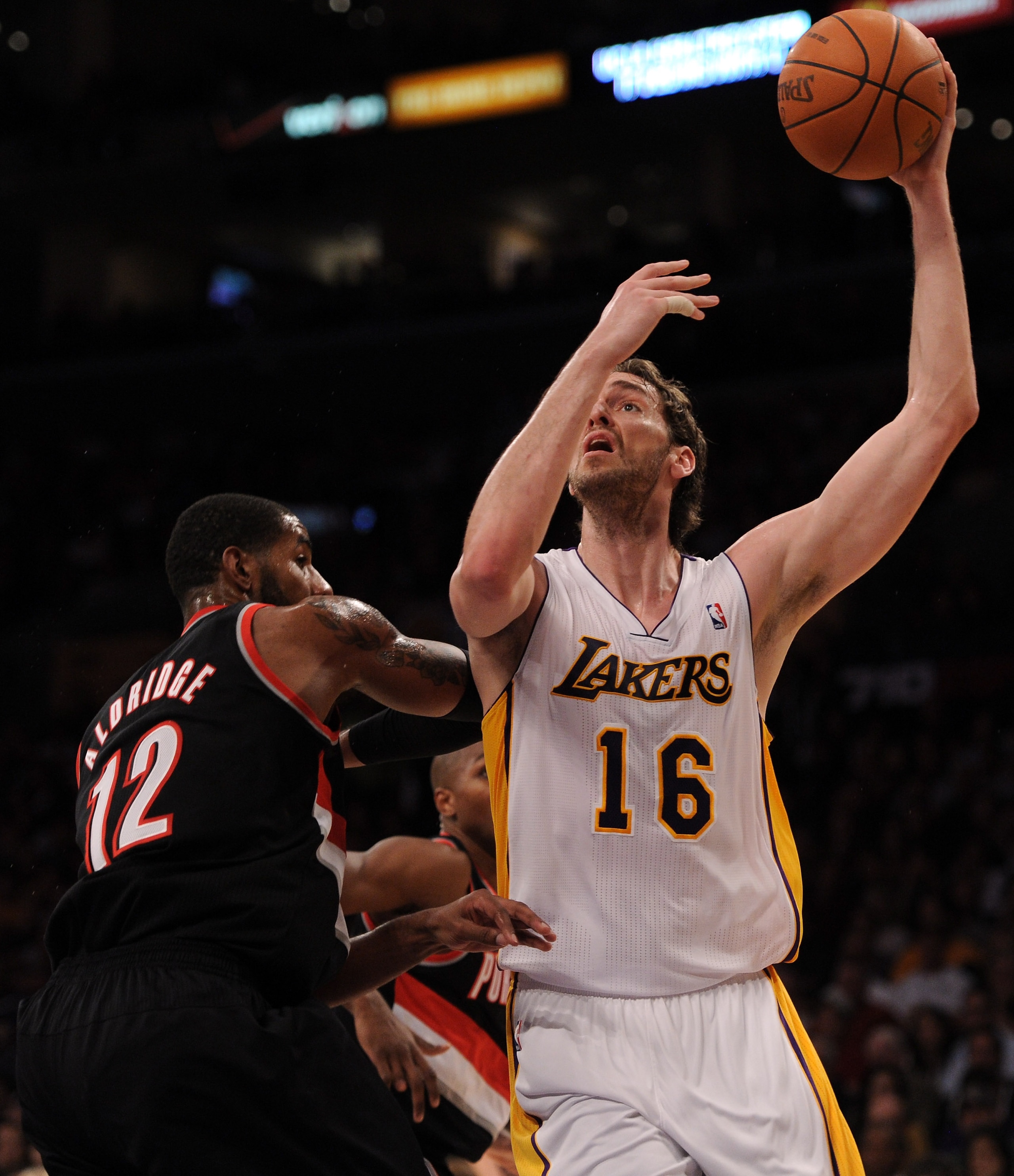 LOS ANGELES, CA - NOVEMBER 07:  Pau Gasol #16 of the Los Angeles Lakers shoots a jump hook over LaMarcus Aldridge #12 of the Portland Trail Blazers at the Staples Center on November 7, 2010 in Los Angeles, California.  NOTE TO USER: User expressly acknowl