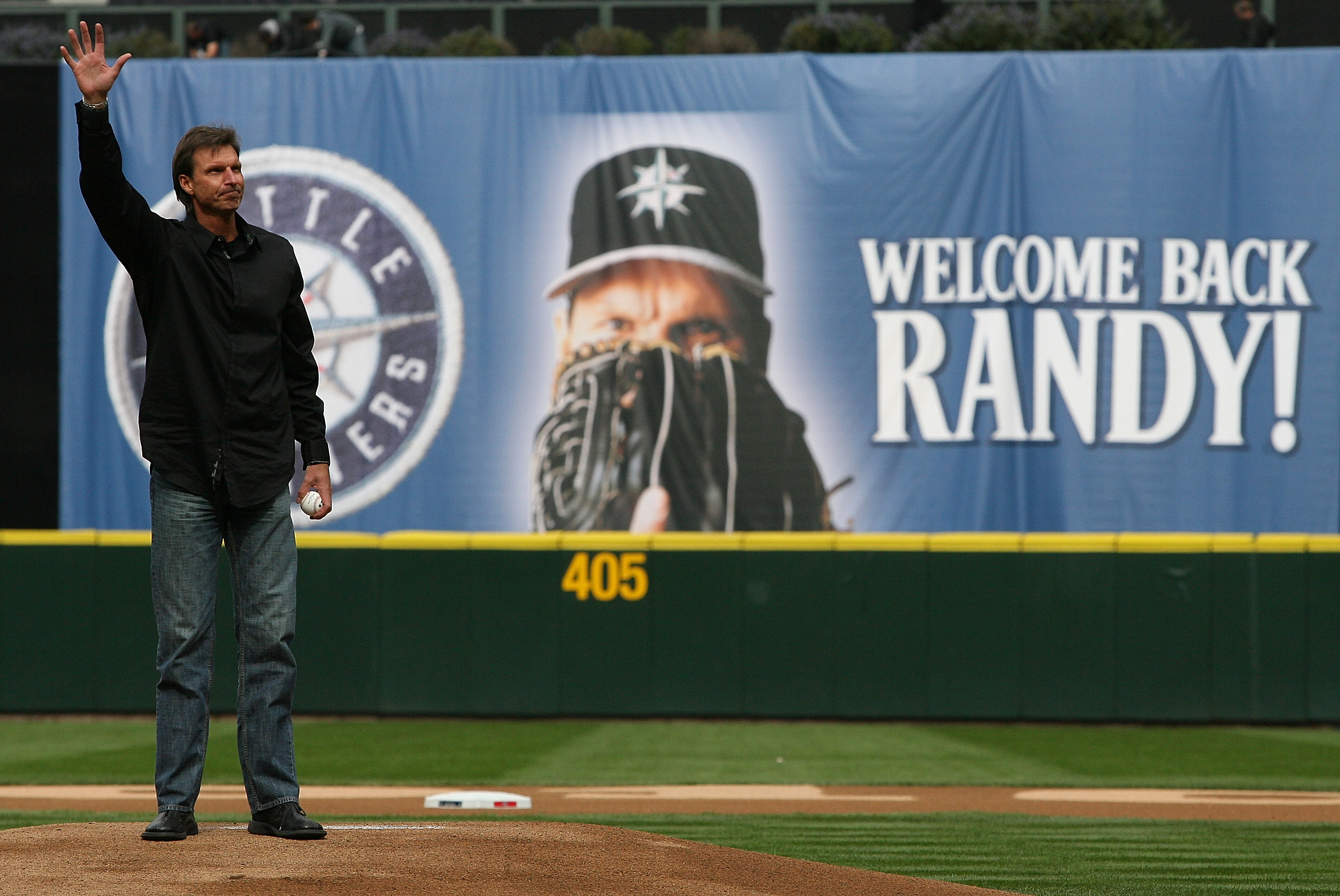 SEATTLE - APRIL 12:  Former Mariners star Randy Johnson waves to the crowd prior to throwing out the ceremonial first pitch before the Mariners' home opener against the Oakland Athletics at Safeco Field on April 12, 2010 in Seattle, Washington. (Photo by