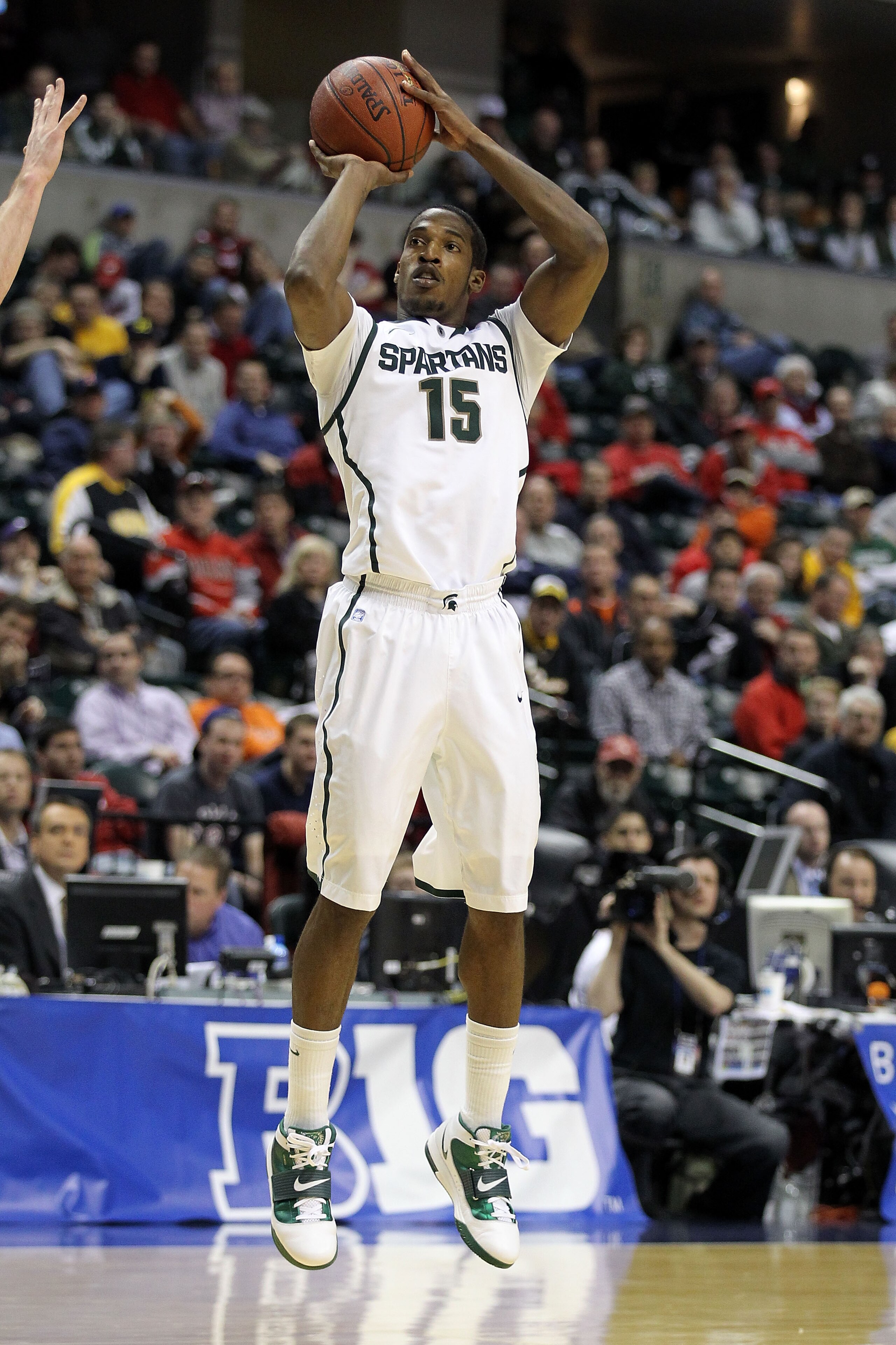 INDIANAPOLIS, IN - MARCH 10:  Durrell Summers #15 of the Michigan State Spartans attempts a shot against the Iowa Hawkeyes during the first round of the 2011 Big Ten Men's Basketball Tournament at Conseco Fieldhouse on March 10, 2011 in Indianapolis, Indi