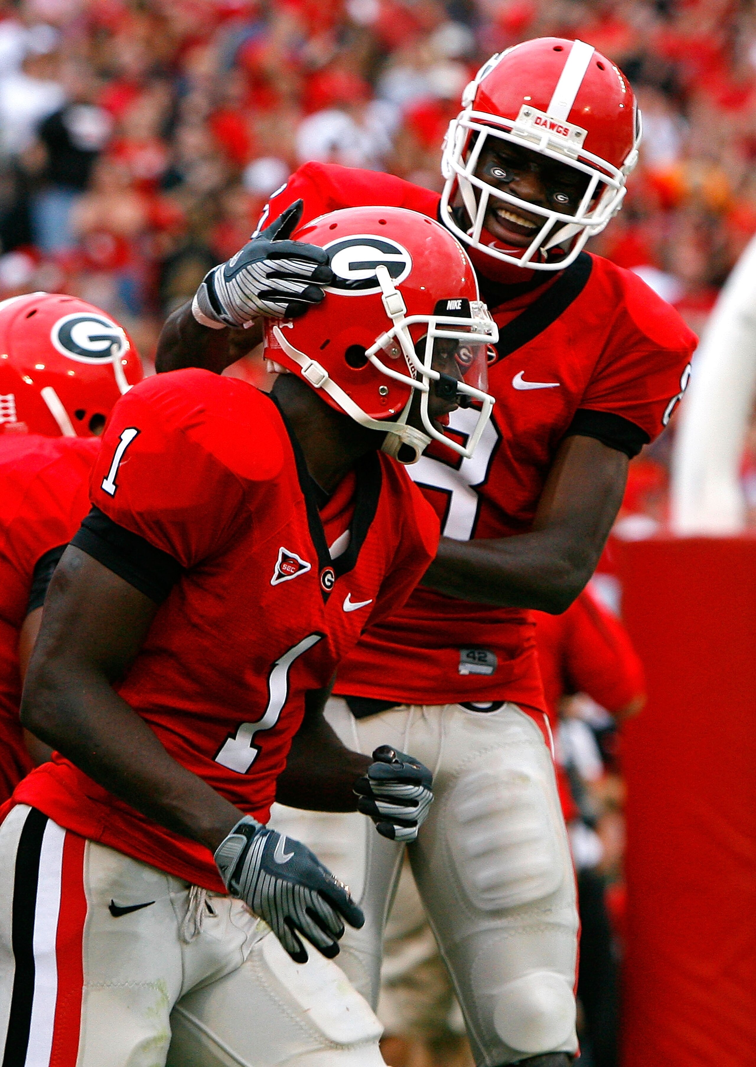 ATHENS, GA - OCTOBER 11: A.J. Green #8 congratulates Mohamed Massaquoi #1 of the Georgia Bulldogs after Massaquoi's touchdown against the Tennessee Volunteers to end the first half at Sanford Stadium on October 11, 2008 in Athens, Georgia. (Photo by Kev ATHENS, GA - OCTOBER 11: A.J. Green #8 congratulates Mohamed Massaquoi #1 of the Georgia Bulldogs after Massaquoi's touchdown against the Tennessee Volunteers to end the first half at Sanford Stadium on October 11, 2008 in Athens, Georgia. (Photo by Kev