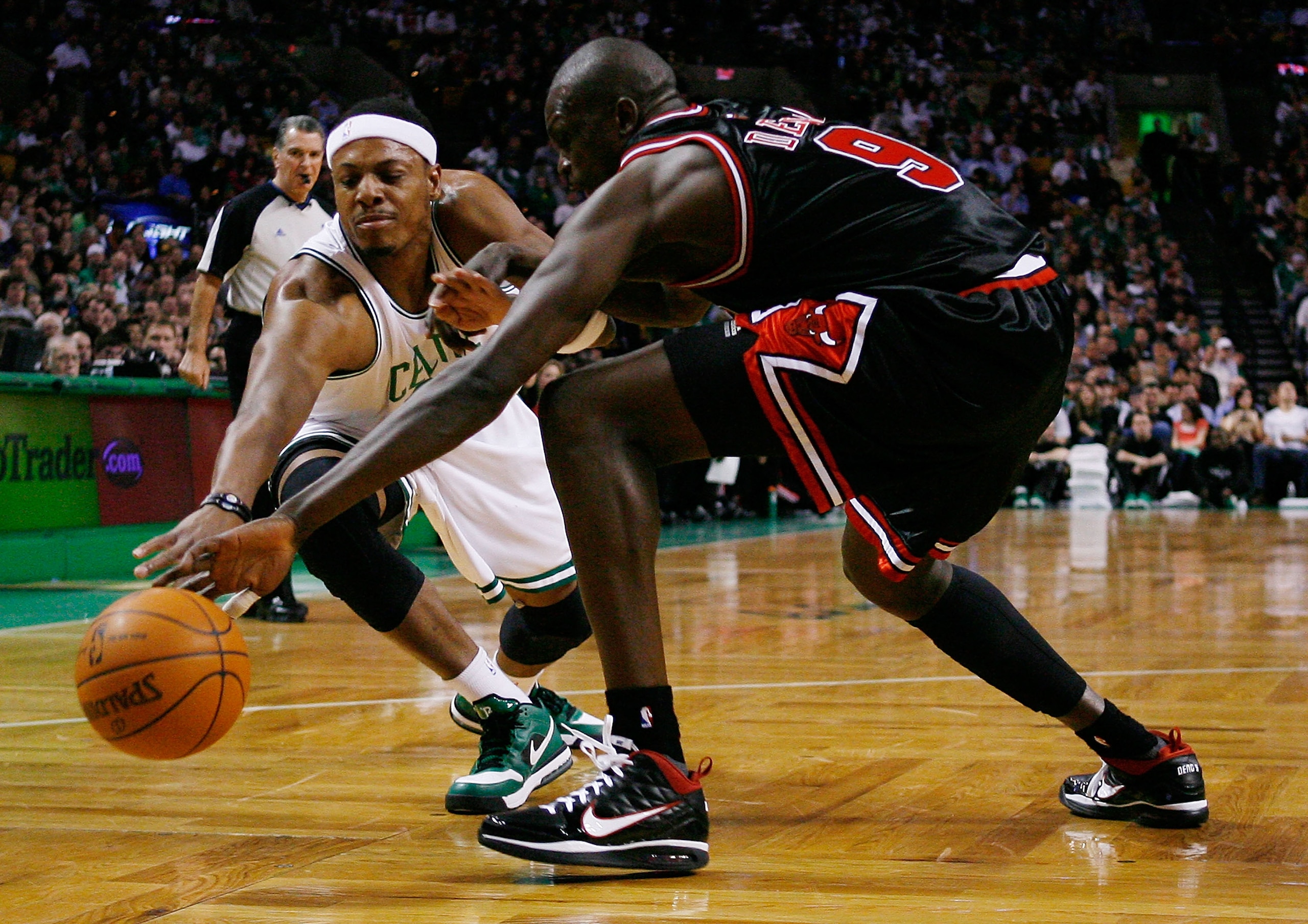 BOSTON - JANUARY 14:  Paul Pierce #34 of the Boston Celtics loses control of the ball as Luol Deng #9 of the Chicago Bulls makes the steal in the first quarter at the TD Garden on January 14, 2010 in Boston, Massachusetts.  NOTE TO USER: User expressly ac