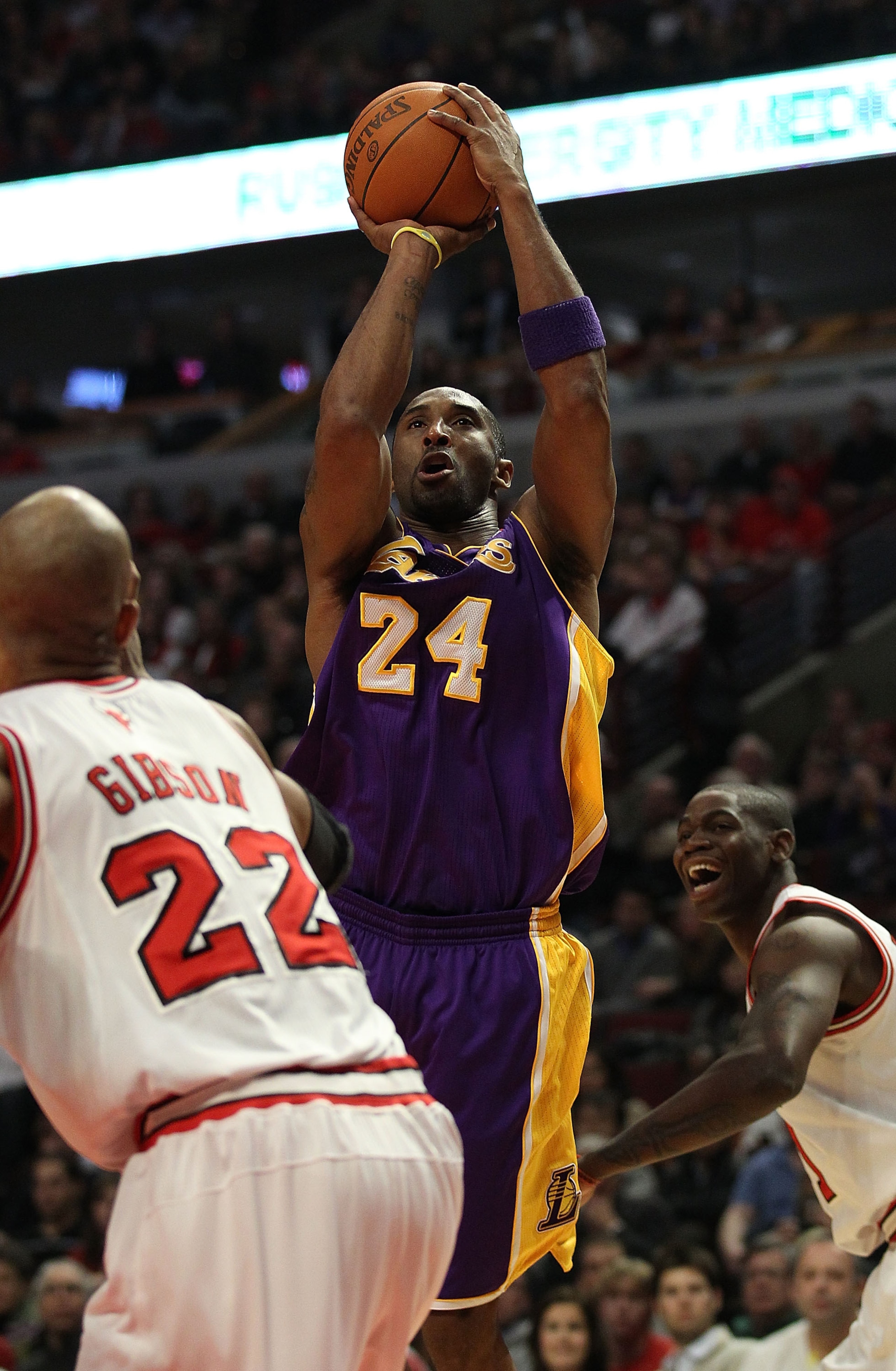 CHICAGO, IL - DECEMBER 10: Kobe Bryant #24 of the Los Angeles Lakers puts up a shot over Taj Gibson #22 of the Chicago Bulls at the United Center on December 10, 2010 in Chicago, Illinois. The Bulls defeated the Lakers 88-84. NOTE TO USER: User expressly