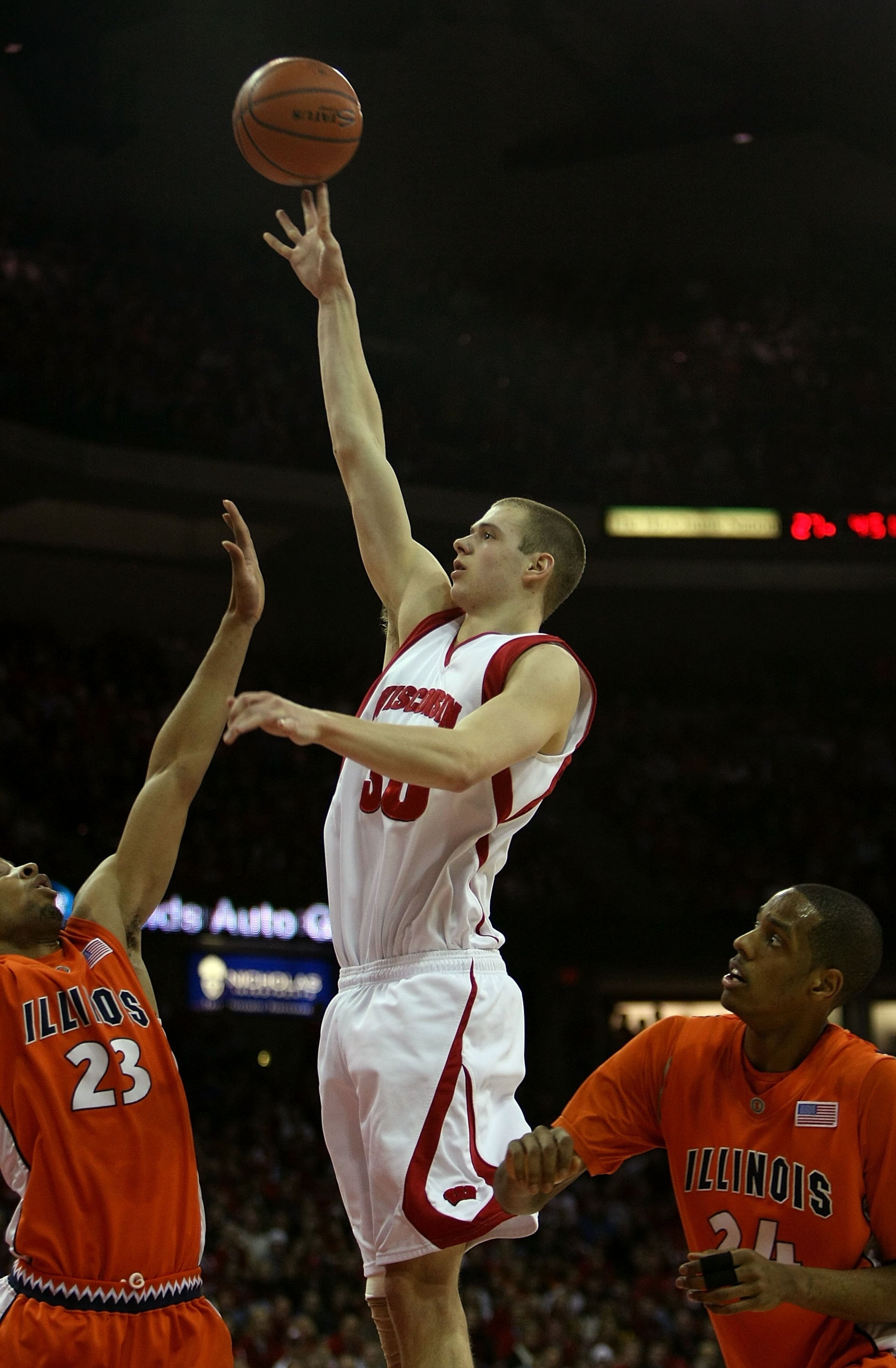 MADISON, WI - FEBRUARY 05: Jon Leuer #30 of the Wisconsin Badgers puts up a shot between Dominique Keller #23 and Mike Davis #24 of the Illinois Fighting Illini on February 5, 2009 at the Kohl Center in Madison, Wisconsin. Wisconsin defeated Illinois 63-5