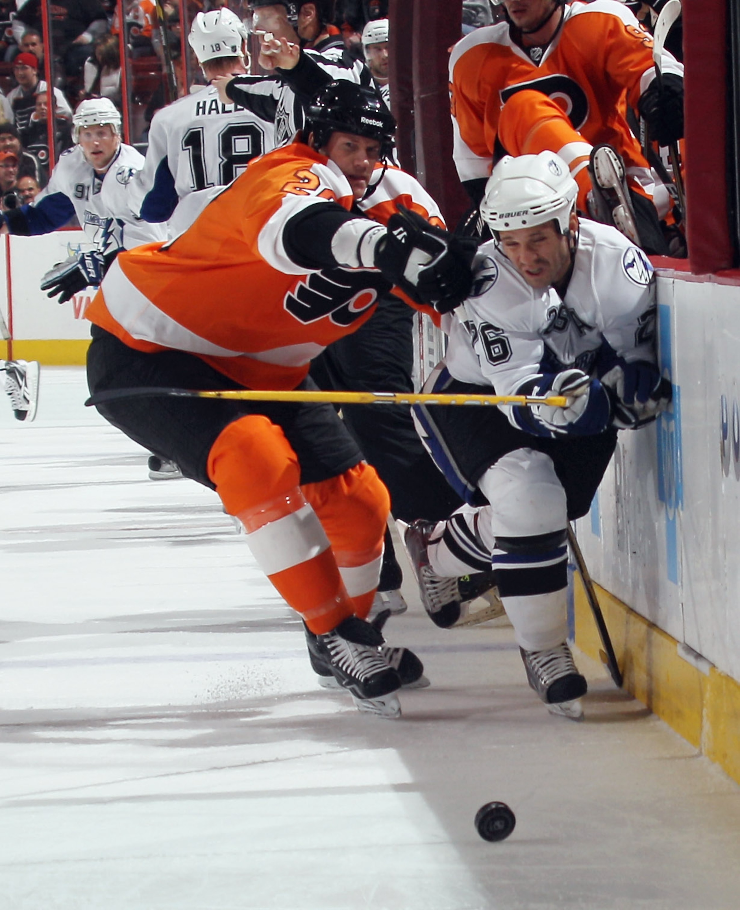 PHILADELPHIA - NOVEMBER 18: Chris Pronger #20 of the Philadelphia Flyers hits Martin St. Louis #26 of the Tampa Bay Lightning at the Wells Fargo Center on November 18, 2010 in Philadelphia, Pennsylvania.  (Photo by Bruce Bennett/Getty Images)