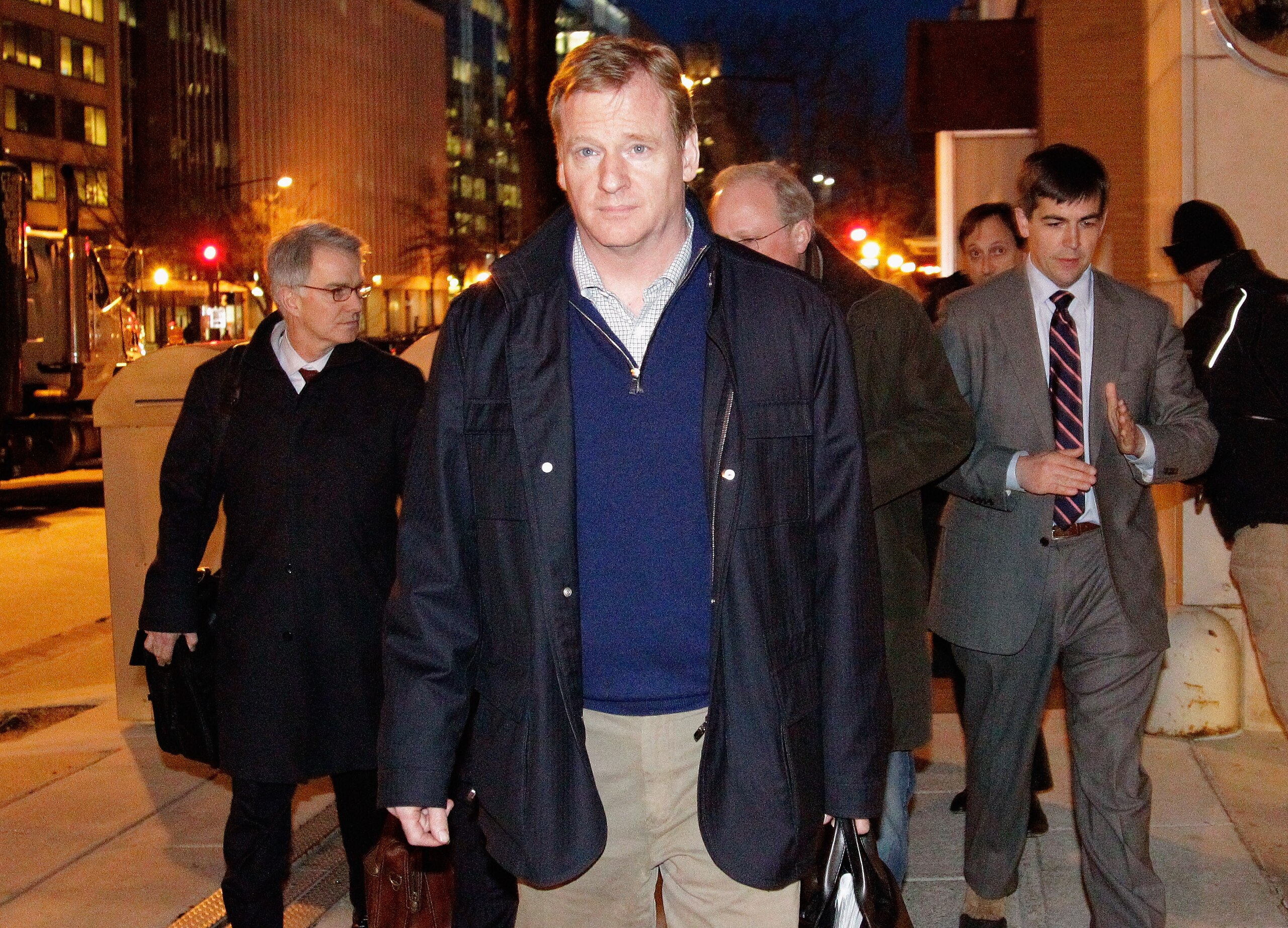 WASHINGTON, DC - MARCH 08: NFL Commissioner Roger  (C) leaves negotiations at the Federal Mediation and Conciliation Service building March 8, 2011 in Washington, DC. Representatives from the National Football League (NFL) and National Football League Pla