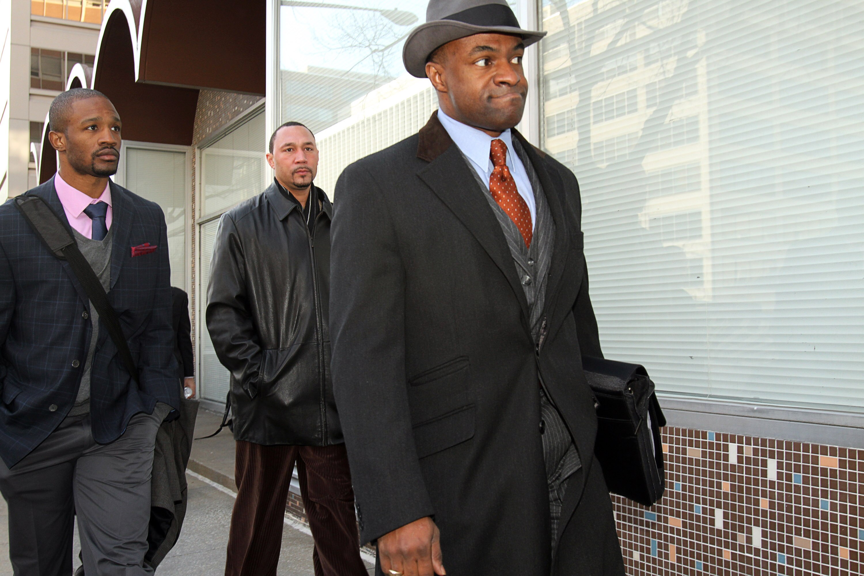 WASHINGTON, DC - MARCH 08: National Football League Players' Association (NFLPA) executive director DeMaurice Smith (R) and Pittsburgh Steelers quarterback Charlie Batch (C) arrive with players for negotiations at the Federal Mediation and Conciliation Se
