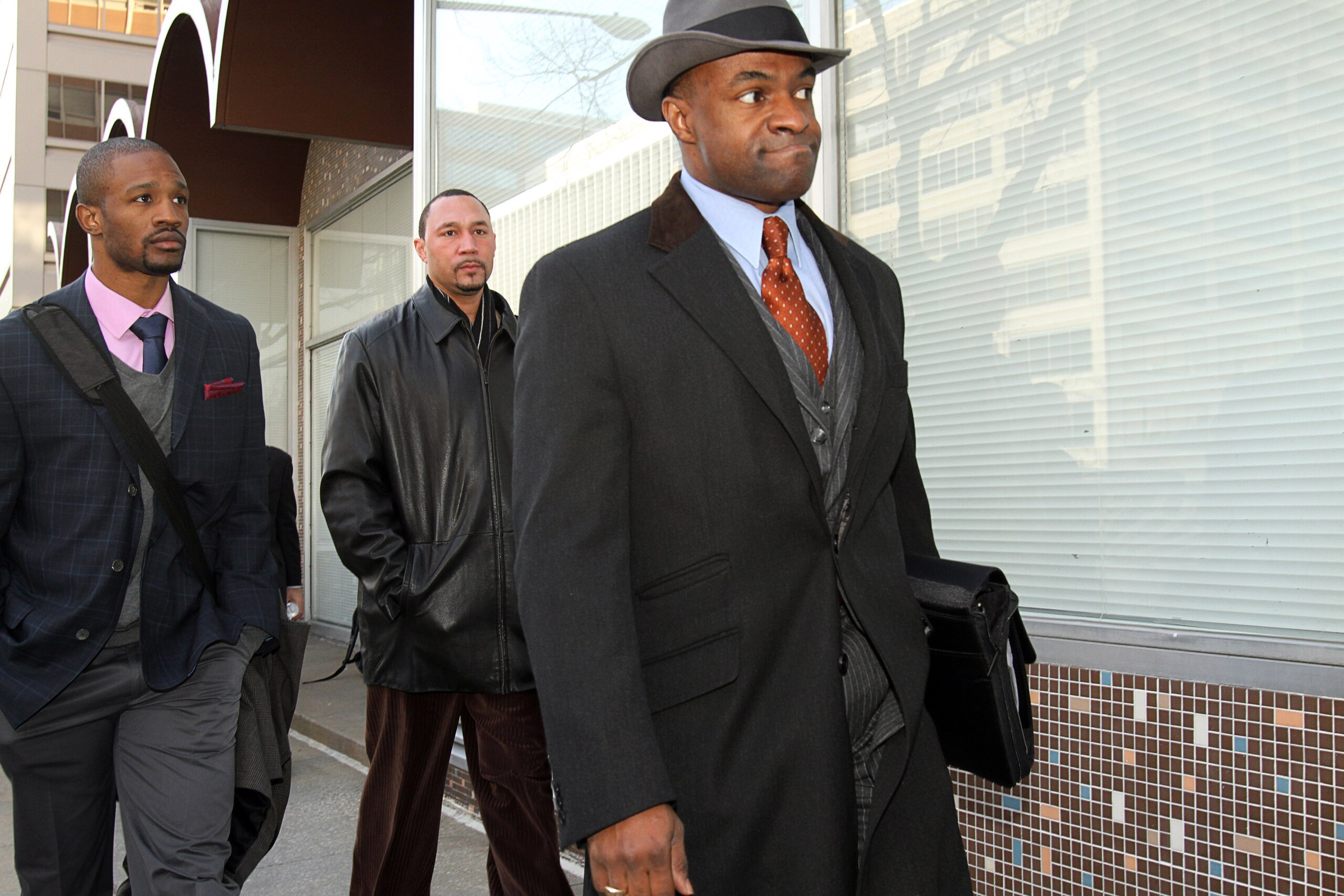 WASHINGTON, DC - MARCH 08: National Football League Players' Association (NFLPA) executive director DeMaurice Smith (R) and Pittsburgh Steelers quarterback Charlie Batch (C) arrive with players for negotiations at the Federal Mediation and Conciliation Se