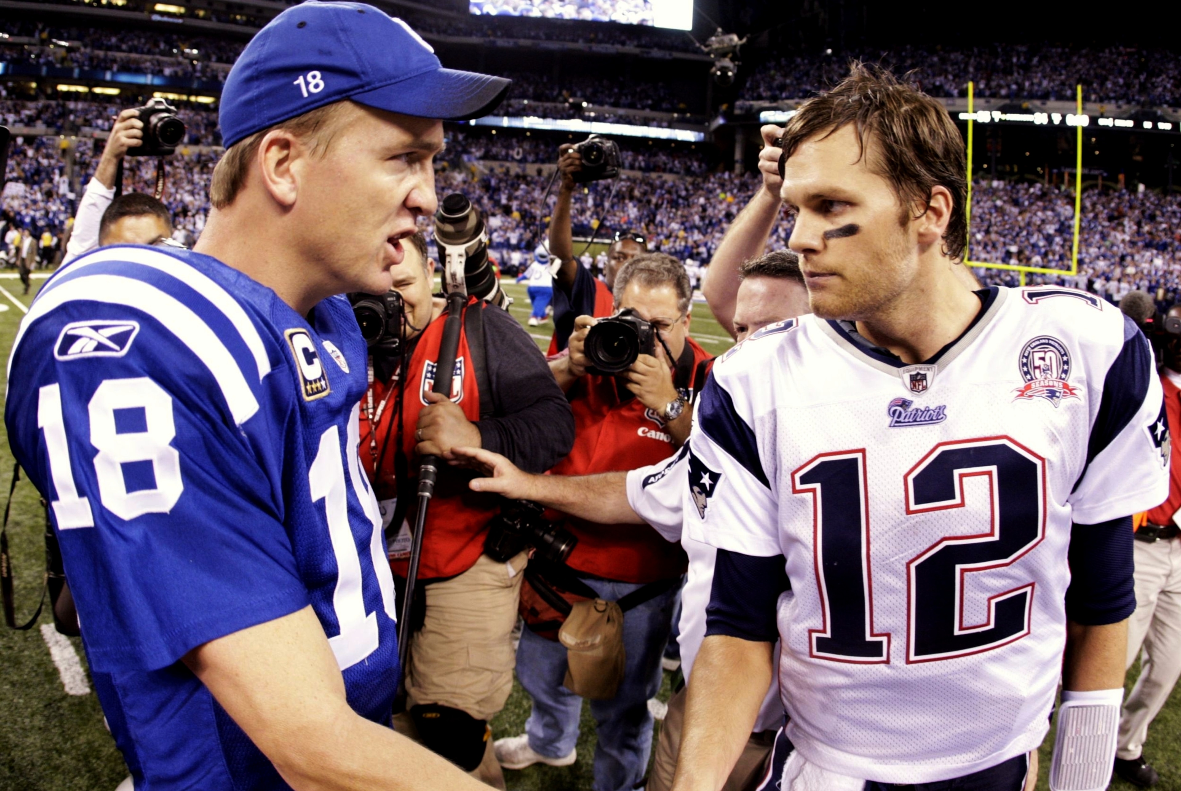 INDIANAPOLIS - NOVEMBER 15:  Quarterback Peyton Manning #18 of the Indianapolis Colts greets Tom Brady #12 of the New England Patriots after the game at Lucas Oil Stadium on November 15, 2009 in Indianapolis, Indiana.  The Colts won the game 35-34.  (Phot