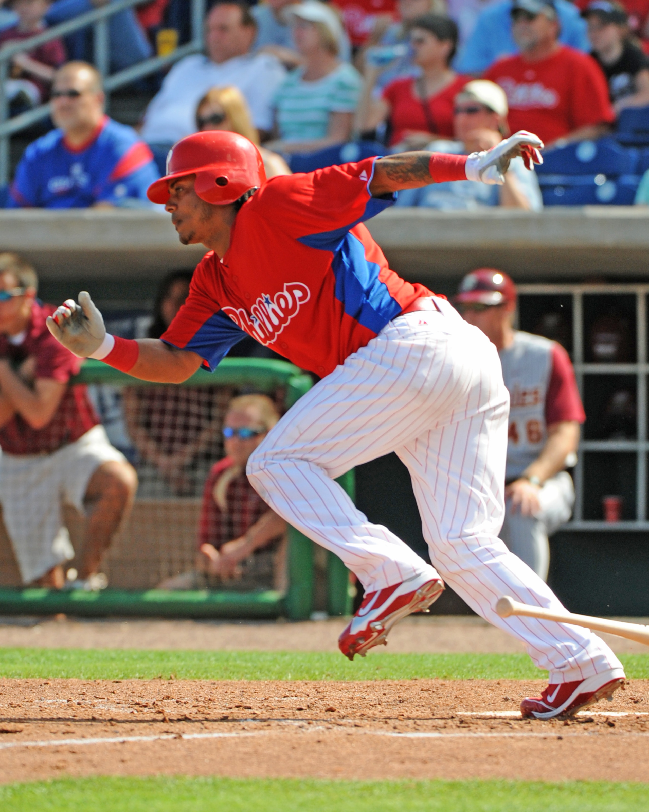 CLEARWATER, FL - FEBRUARY 24:  Infielder Michael Martinez #19  of the Philadelphia Phillies bats against the Florida State Seminoles February 24, 2011 at Bright House Field in Clearwater, Florida.  (Photo by Al Messerschmidt/Getty Images)