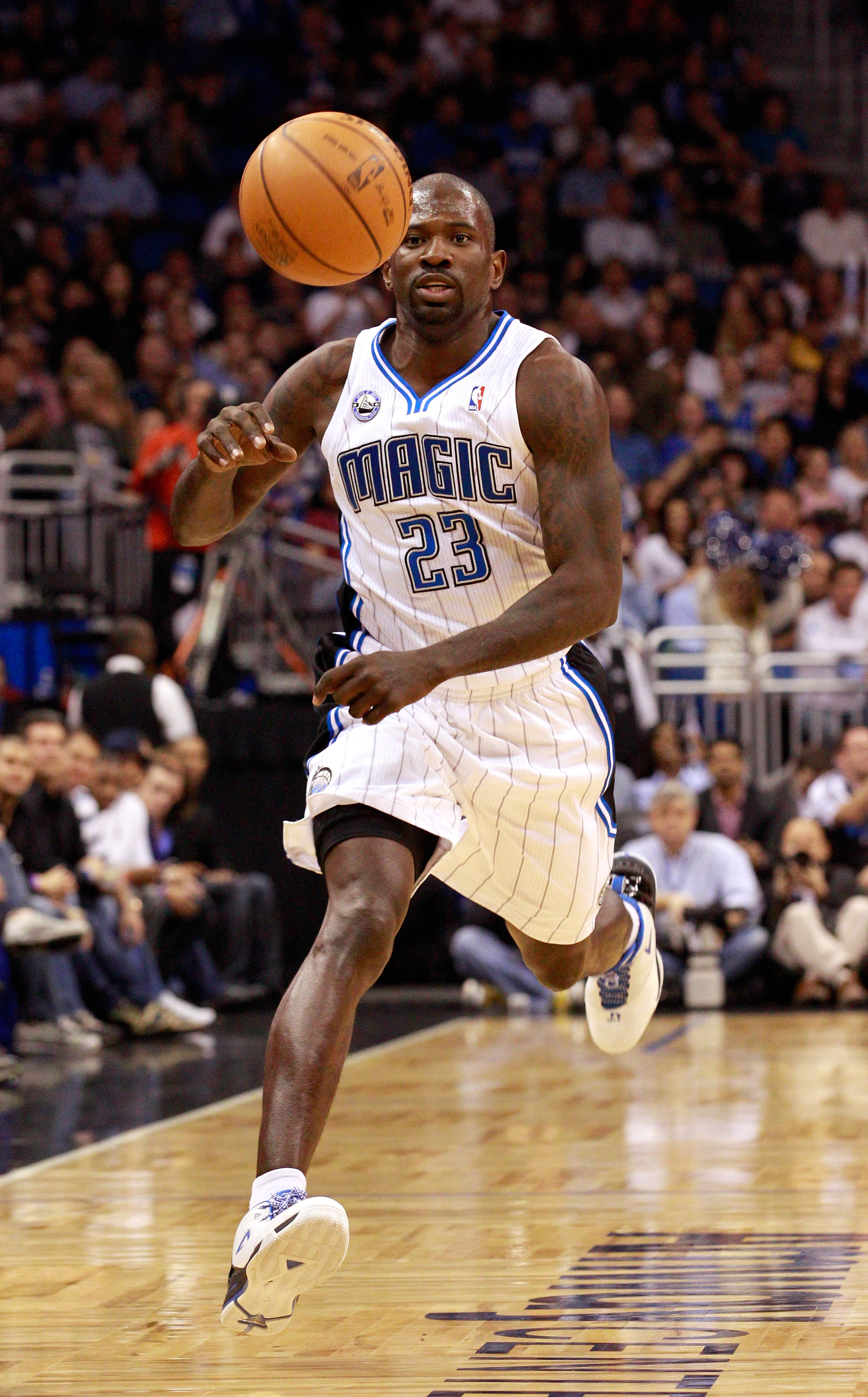 The Orlando Magic's Jason Richardson dunks over the New Jersey Nets'  DeShawn Stevenson during the first half at the Amway Center in Orlando,  Florida, on Friday, March 16, 2012. (Photo by Gary