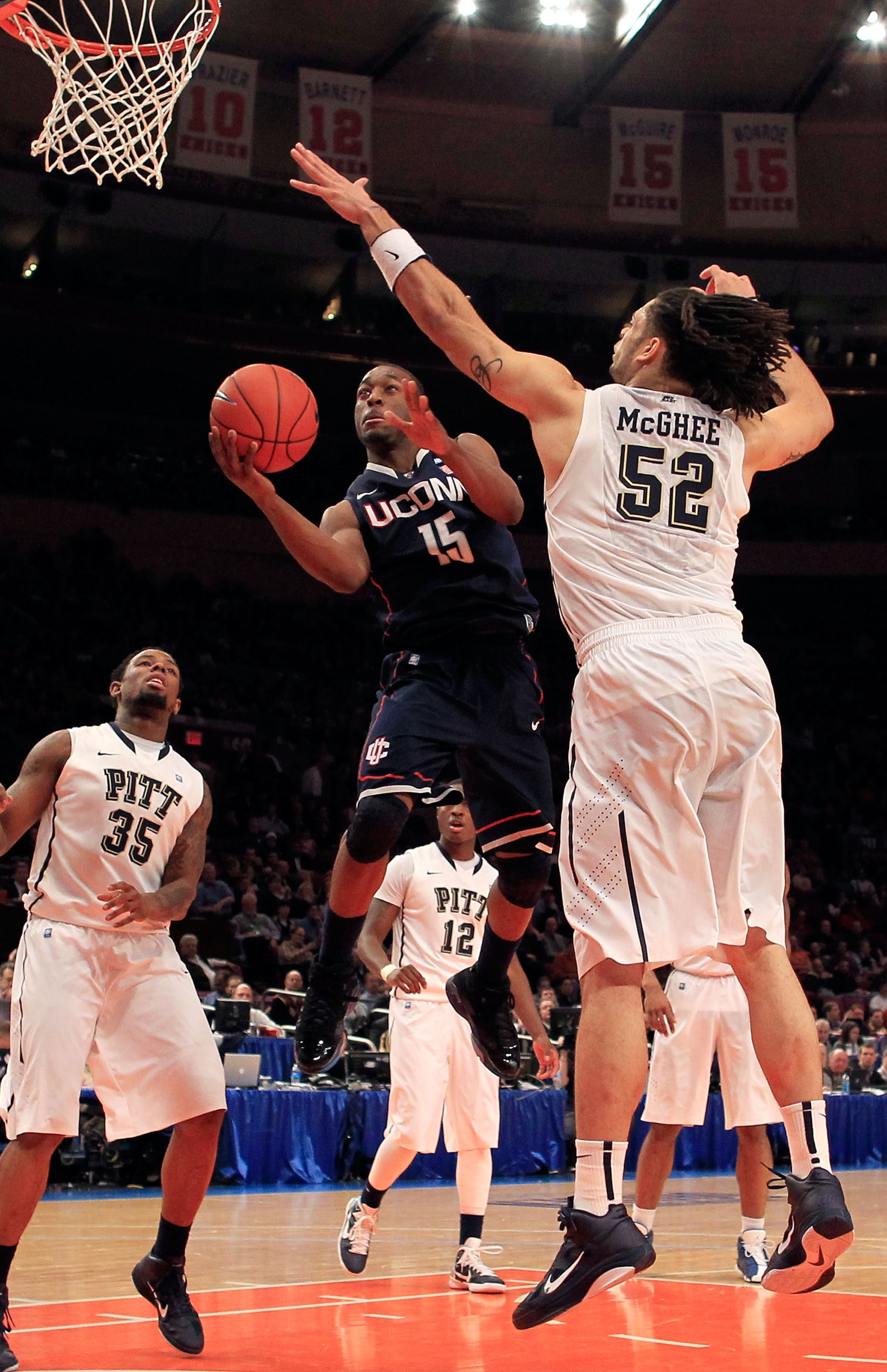 NEW YORK, NY - MARCH 10: Kemba Walker #15 of the Connecticut Huskies drives to the basket against Gary McGhee #52 of the Pittsburgh Panthers during the quarterfinals of the 2011 Big East Men's Basketball Tournament presented by American Eagle Outfitters NEW YORK, NY - MARCH 10: Kemba Walker #15 of the Connecticut Huskies drives to the basket against Gary McGhee #52 of the Pittsburgh Panthers during the quarterfinals of the 2011 Big East Men's Basketball Tournament presented by American Eagle Outfitters