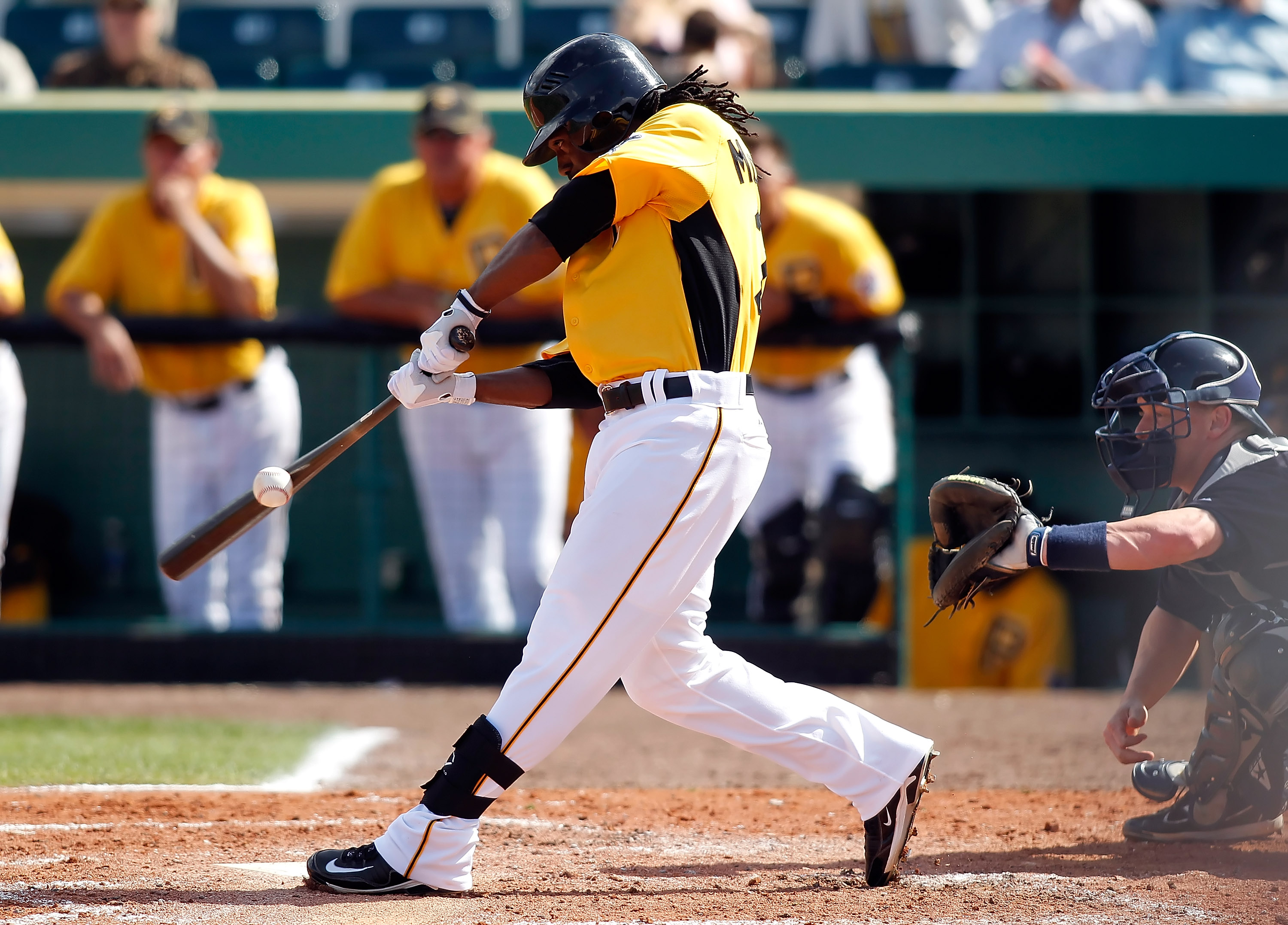 BRADENTON, FL - MARCH 02:  Outfielder Andrew McCutchen #22 of the Pittsburgh Pirates fouls off a pitch against the Minnesota Twins during a Grapefruit League Spring Training Game at McKechnie Field on March 2, 2011 in Bradenton, Florida.  (Photo by J. Mer