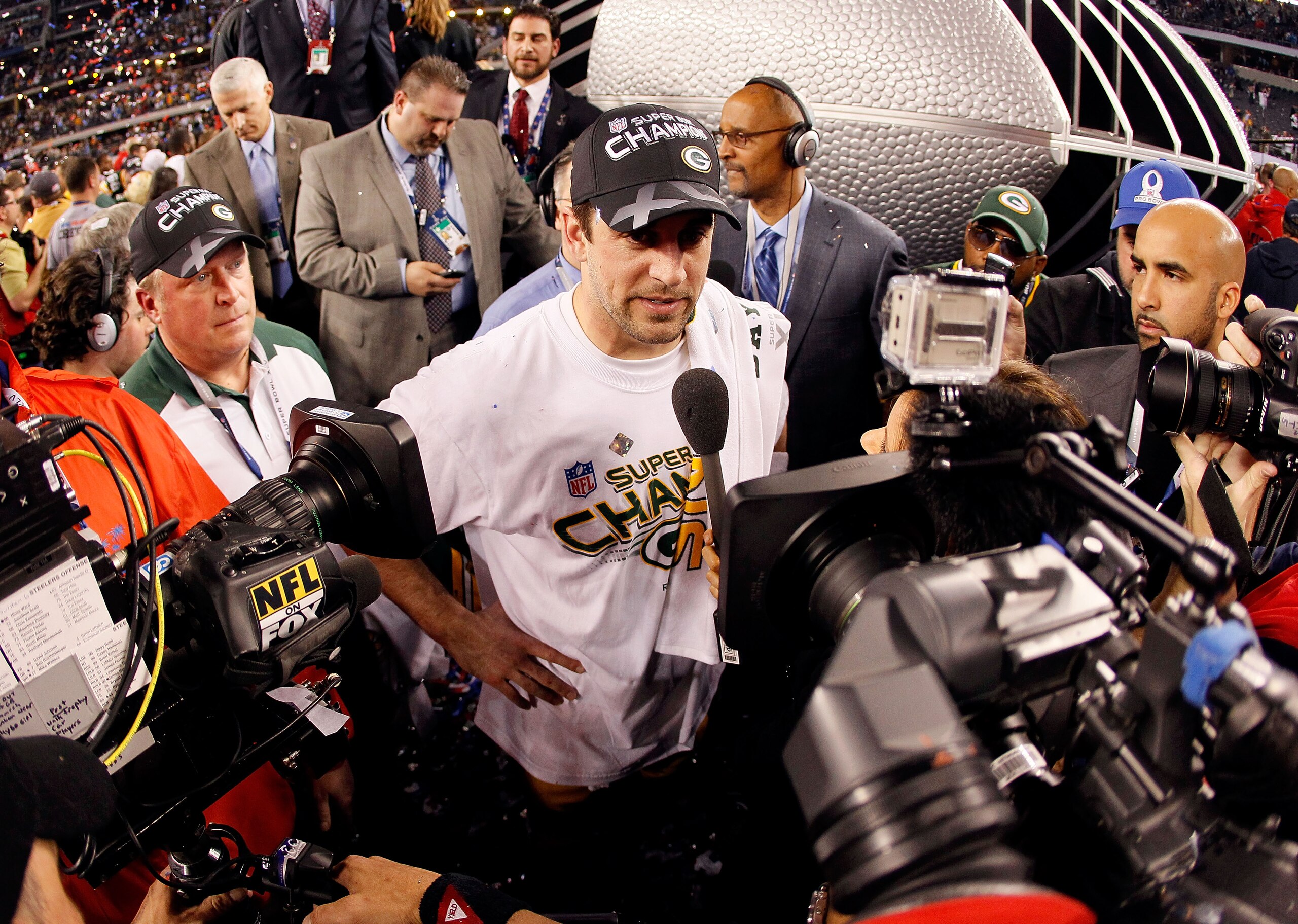 ARLINGTON, TX - FEBRUARY 06:  Super Bowl MVP Aaron Rodgers #12 of the Green Bay Packers is interviewed by the media after the Packers won Super Bowl XLV 31-25 against the Pittsburgh Steelers at Cowboys Stadium on February 6, 2011 in Arlington, Texas.  (Ph