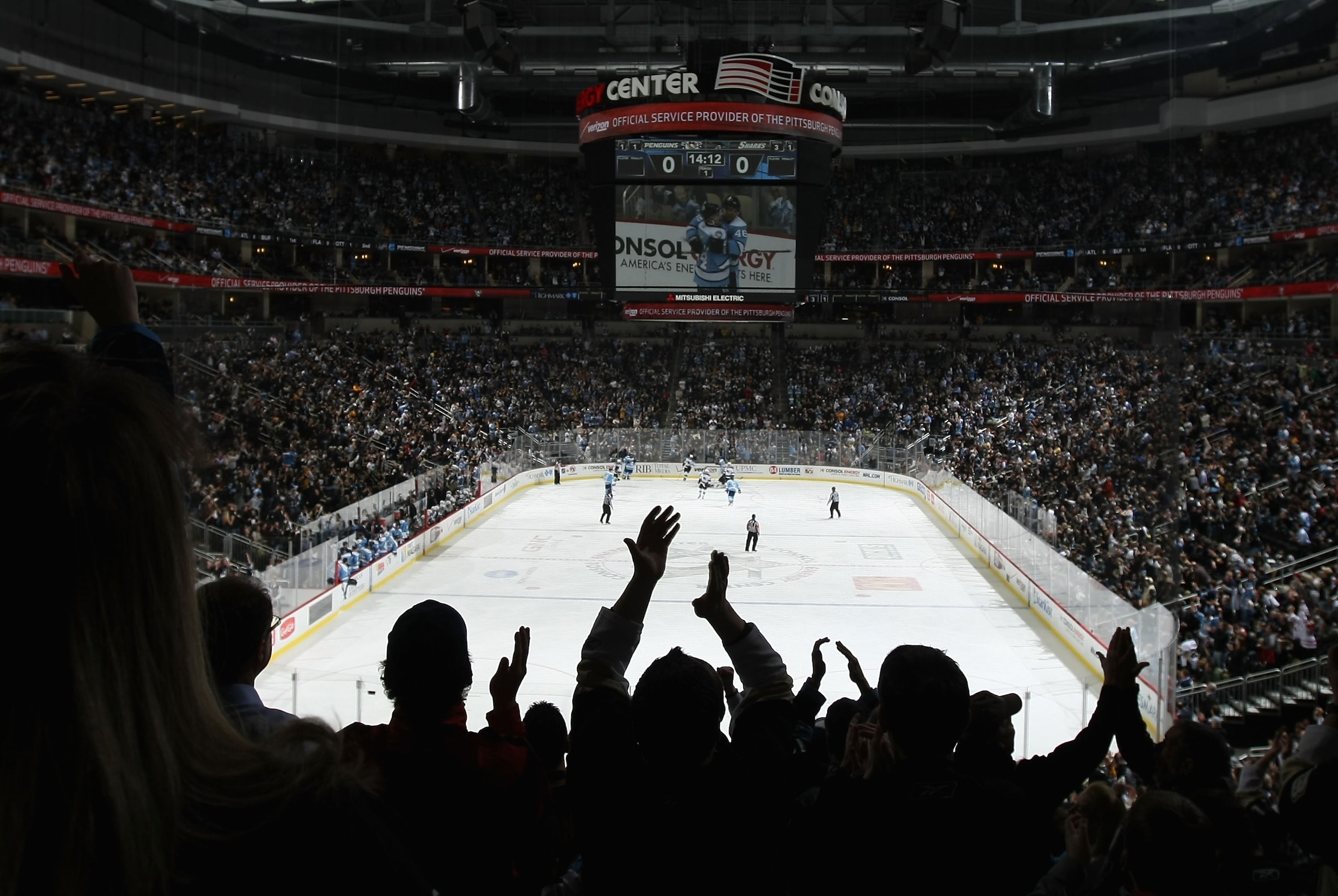 PITTSBURGH, PA - FEBRUARY 23: Fans of the Pittsburgh Penguins cheer after Tyler Kennedy #48 scored a first period goal against the San Jose Sharks during the NHL game at Consol Energy Center on February 23, 2011 in Pittsburgh, Pennsylvania. The Sharks de PITTSBURGH, PA - FEBRUARY 23: Fans of the Pittsburgh Penguins cheer after Tyler Kennedy #48 scored a first period goal against the San Jose Sharks during the NHL game at Consol Energy Center on February 23, 2011 in Pittsburgh, Pennsylvania. The Sharks de