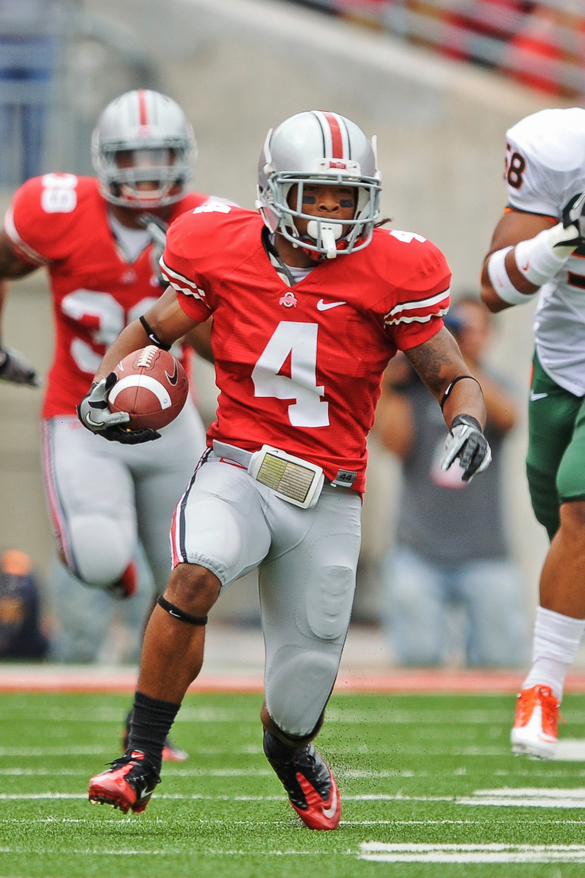 COLUMBUS, OH - SEPTEMBER 11:  Jaamal Berry #4 of the Ohio State Buckeyes runs with the ball against the Miami Hurricanes at Ohio Stadium on September 11, 2010 in Columbus, Ohio.  (Photo by Jamie Sabau/Getty Images)