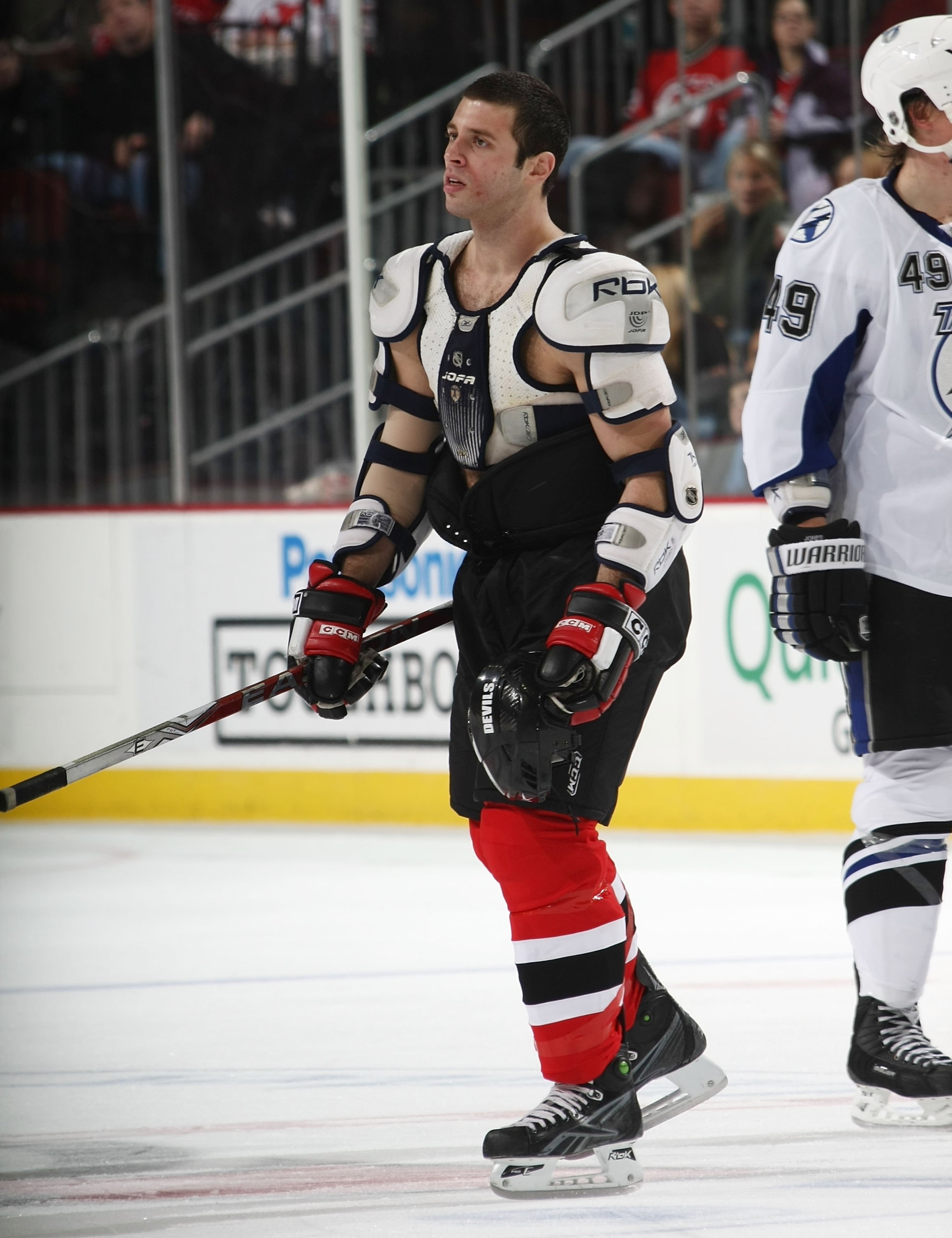 NEWARK, NJ - DECEMBER 04: Matthew Corrente #32 of the New Jersey Devils skates returns to the bench after a fight aginst the Tampa Bay Lightning at the Prudential Center on December 4, 2009 in Newark, New Jersey. (Photo by Bruce Bennett/Getty Images)
