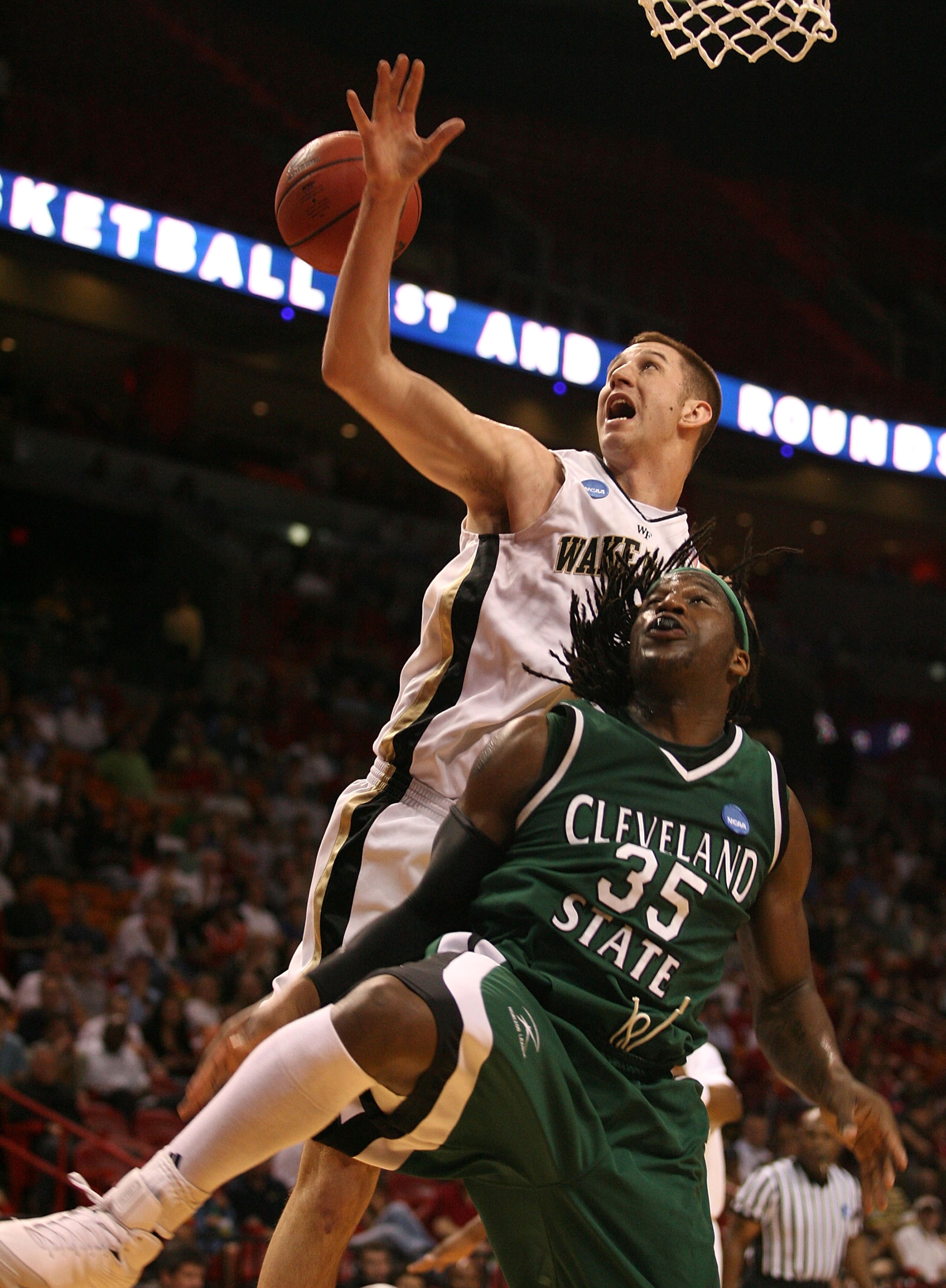 MIAMI - MARCH 20: Forward J'Nathan Bullock #35 (R) of the Cleveland State University Vikings battles for a loose ball against Chas McFarland #13 (L) of Wake Forest Demon Deacons during the first round of the NCAA Division I Men's Basketball Tournament at MIAMI - MARCH 20: Forward J'Nathan Bullock #35 (R) of the Cleveland State University Vikings battles for a loose ball against Chas McFarland #13 (L) of Wake Forest Demon Deacons during the first round of the NCAA Division I Men's Basketball Tournament at