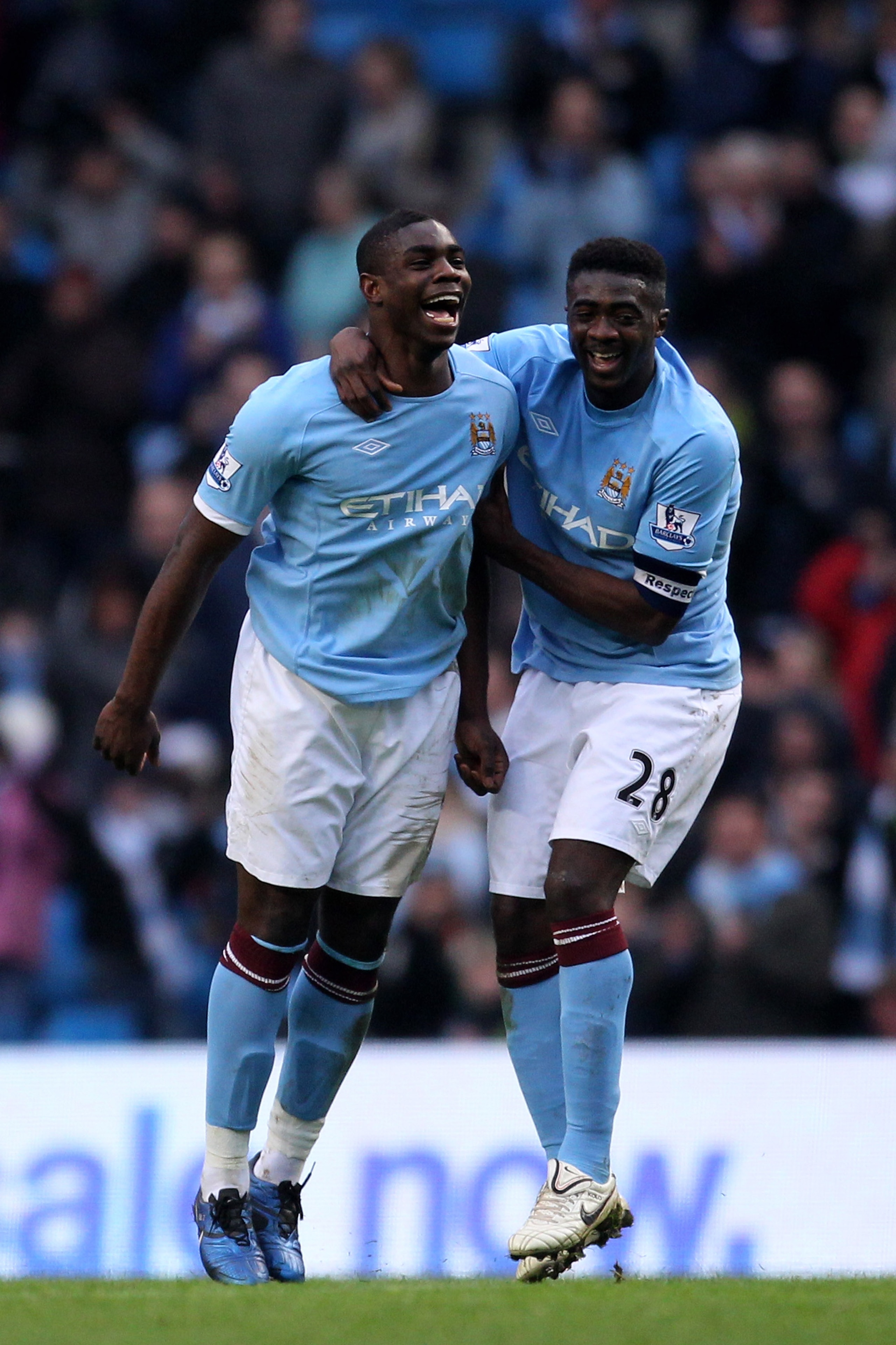 MANCHESTER, ENGLAND - FEBRUARY 20:  Micah Richards of Manchester City celebrates scoring the fifth goal with Kolo Toure during the FA Cup sponsored by E.On 4th Round replay match between Manchester City and Notts County at City of Manchester Stadium on Fe