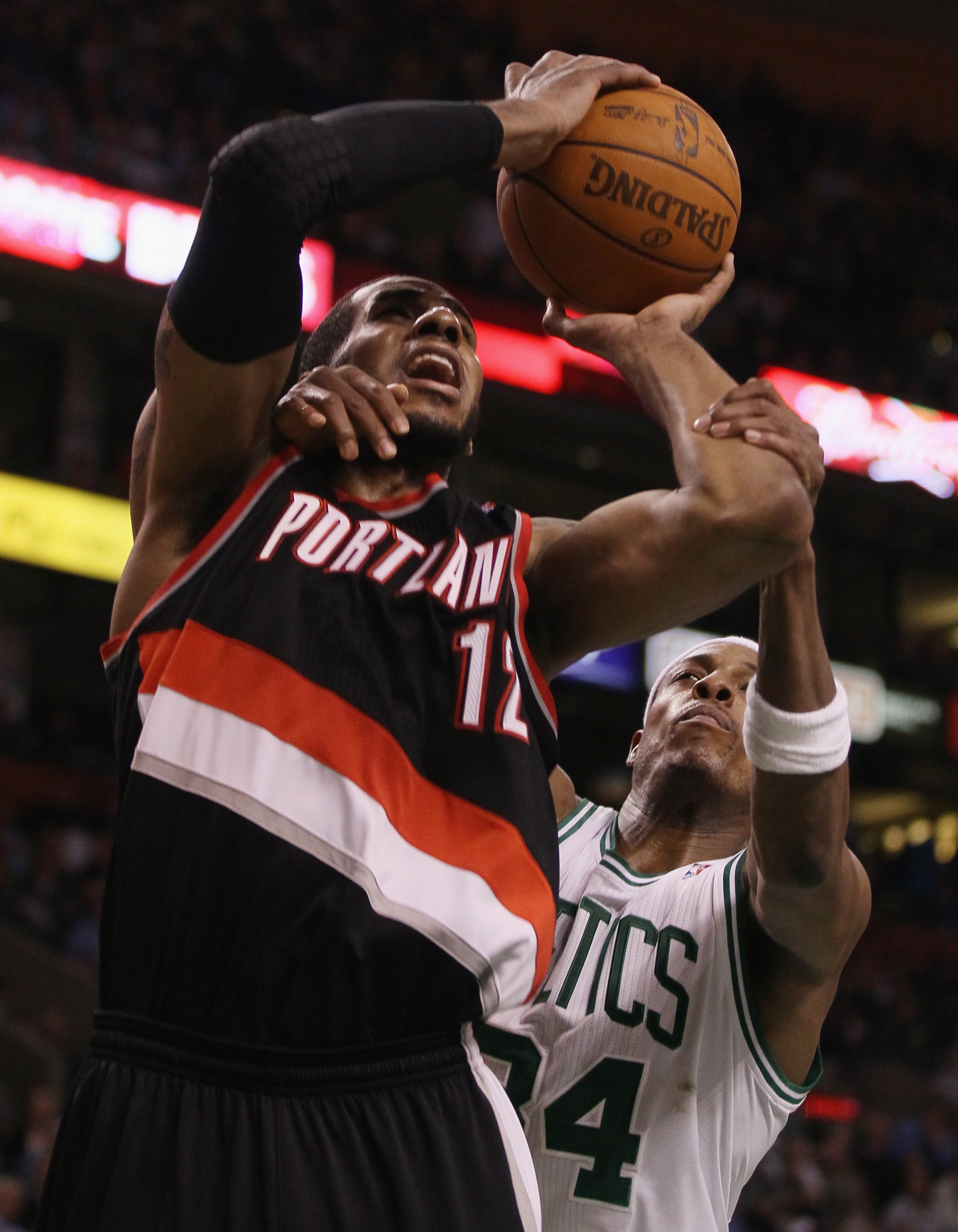BOSTON - DECEMBER 01:  Paul Pierce #34 of the Boston Celtics fouls LaMarcus Aldridge #12 of the Portland Trailblazers on December 1, 2010 at the TD Garden in Boston, Massachusetts. The Celtics defeated the Trailblazers 99-95. NOTE TO USER: User expressly