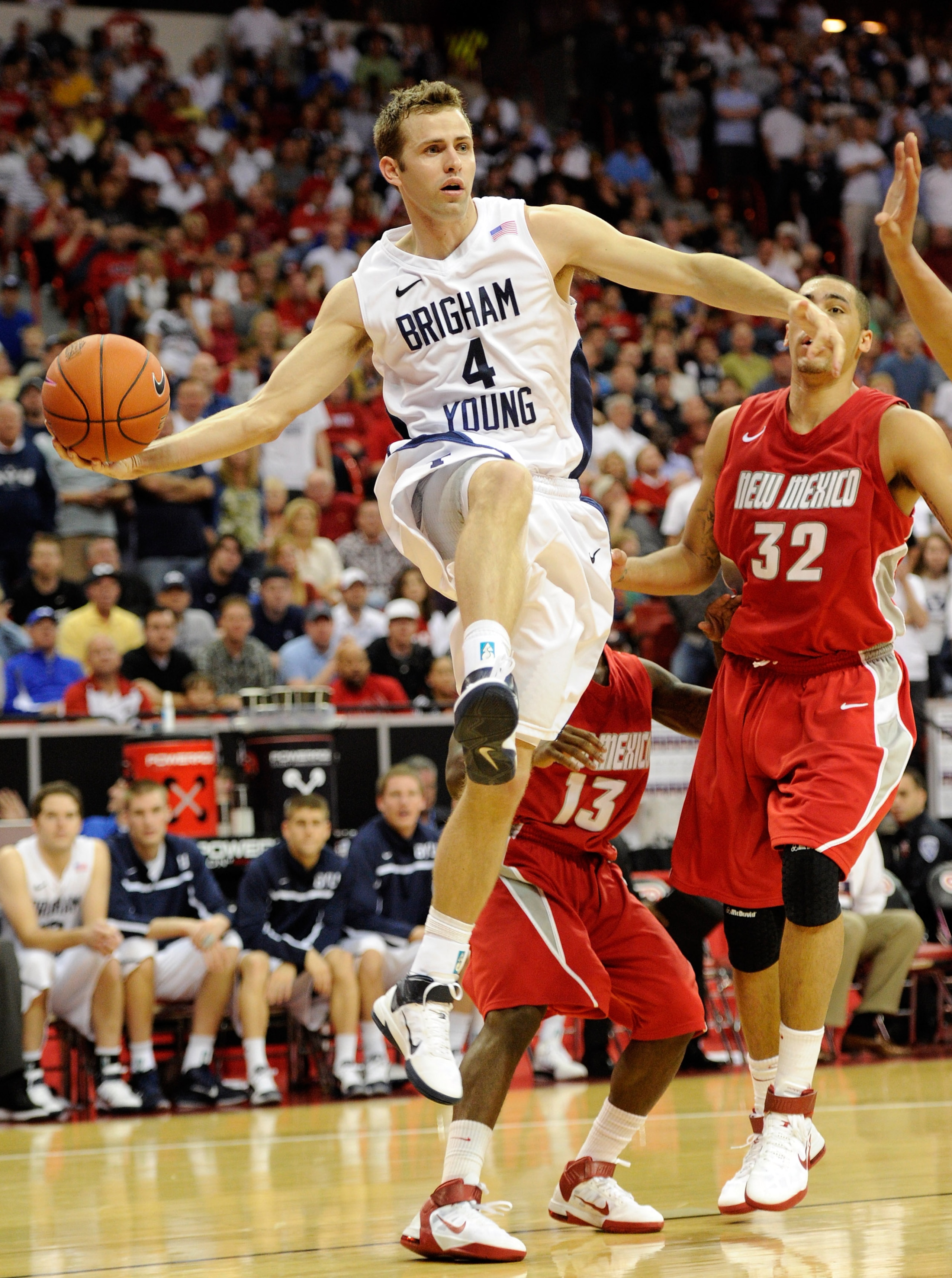 LAS VEGAS, NV - MARCH 11:  Jackson Emery #4 of the Brigham Young University Cougars passes against the New Mexico Lobos during a semifinal game of the Conoco Mountain West Conference Basketball tournament at the Thomas & Mack Center March 11, 2011 in Las