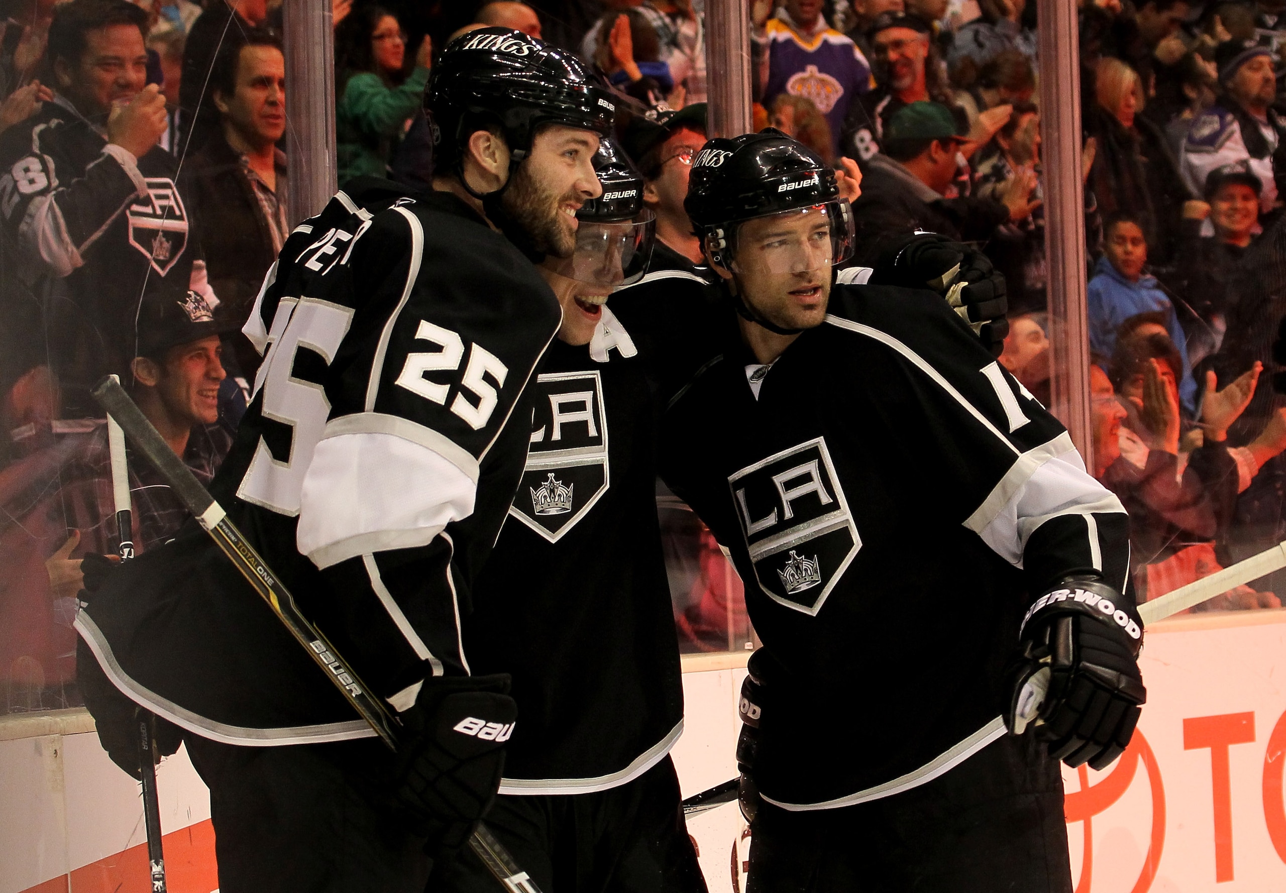 LOS ANGELES, CA - MARCH 7:  Justin Williams #14 (R) of the Los Angeles Kings celebrates with Anze Kopitar #11 (C) and Dustin Penner #25 after his second period goal against the Dallas Stars at Staples Center on March 7, 2011 in Los Angeles, California.   