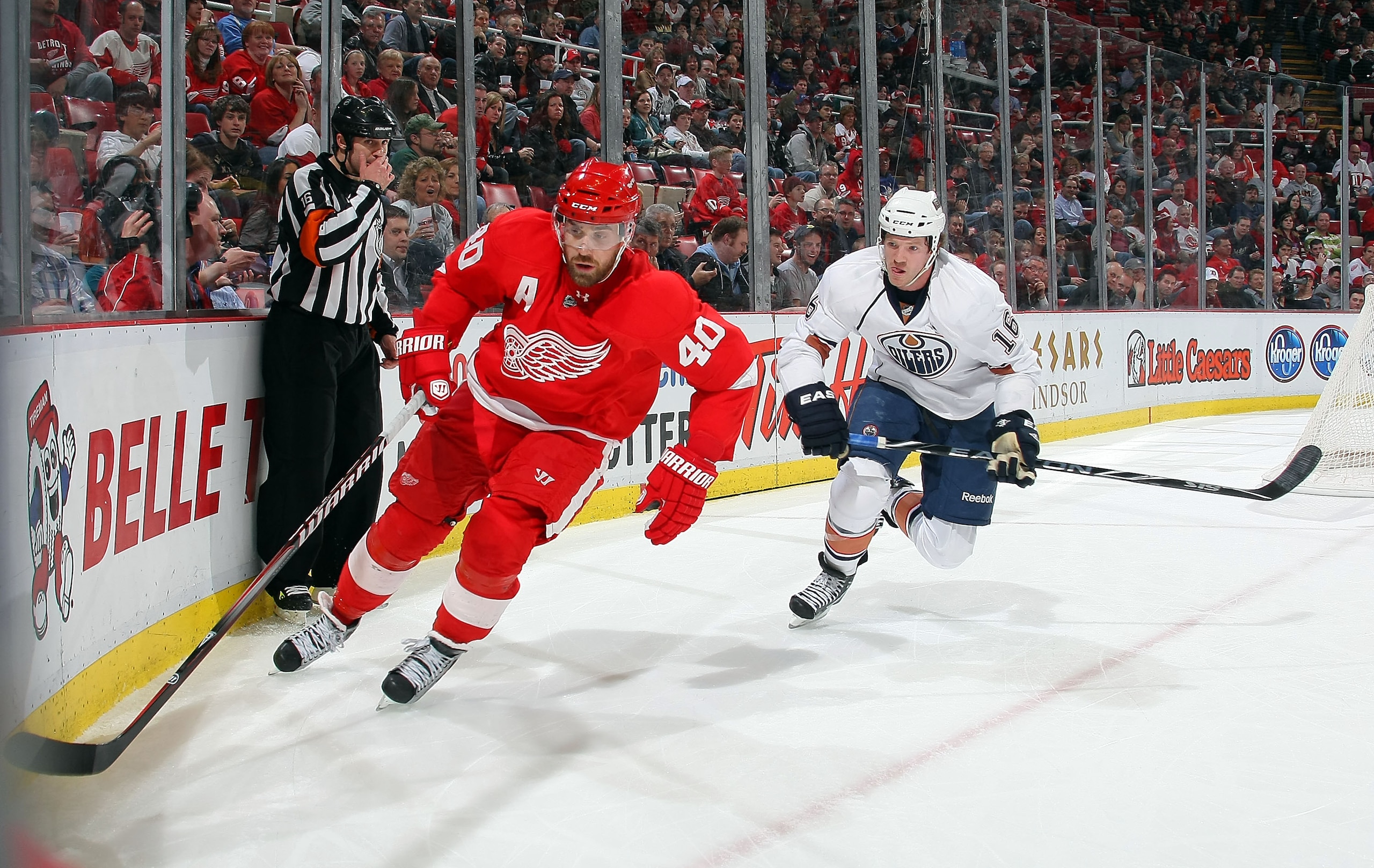 DETROIT, MI - MARCH 11: Colin Fraser #16 of the Edmonton Oilers battles for the puck with Henrik Zetterberg #40 of the Detroit Red Wings during their NHL game at Joe Louis Arena on March 11, 2011 in Detroit, Michigan. (Photo by Dave Sandford/Getty Image DETROIT, MI - MARCH 11: Colin Fraser #16 of the Edmonton Oilers battles for the puck with Henrik Zetterberg #40 of the Detroit Red Wings during their NHL game at Joe Louis Arena on March 11, 2011 in Detroit, Michigan. (Photo by Dave Sandford/Getty Image