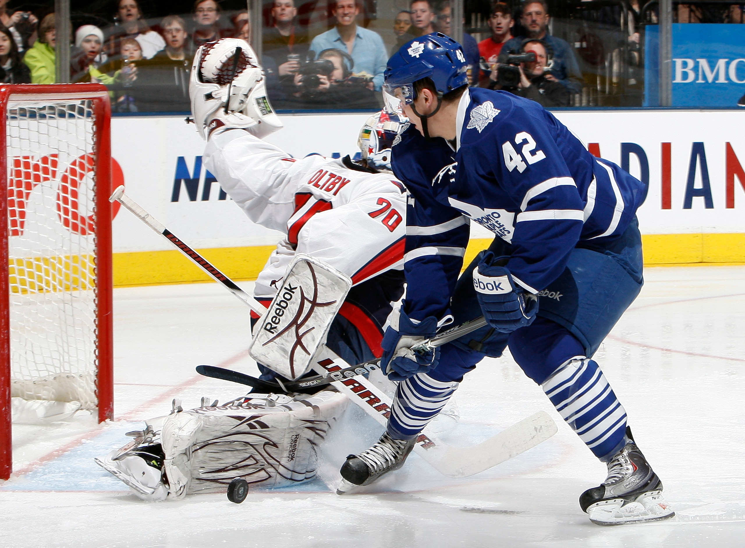 TORONTO, CANADA - JANUARY 22: Tyler Bozak #42 of the Toronto Maple Leafs gets stopped by Braden Holtby #70 of the Washington Capitals during game action at the Air Canada Centre January 22, 2011 in Toronto, Ontario, Canada. (Photo by Abelimages/Getty Imag TORONTO, CANADA - JANUARY 22: Tyler Bozak #42 of the Toronto Maple Leafs gets stopped by Braden Holtby #70 of the Washington Capitals during game action at the Air Canada Centre January 22, 2011 in Toronto, Ontario, Canada. (Photo by Abelimages/Getty Imag
