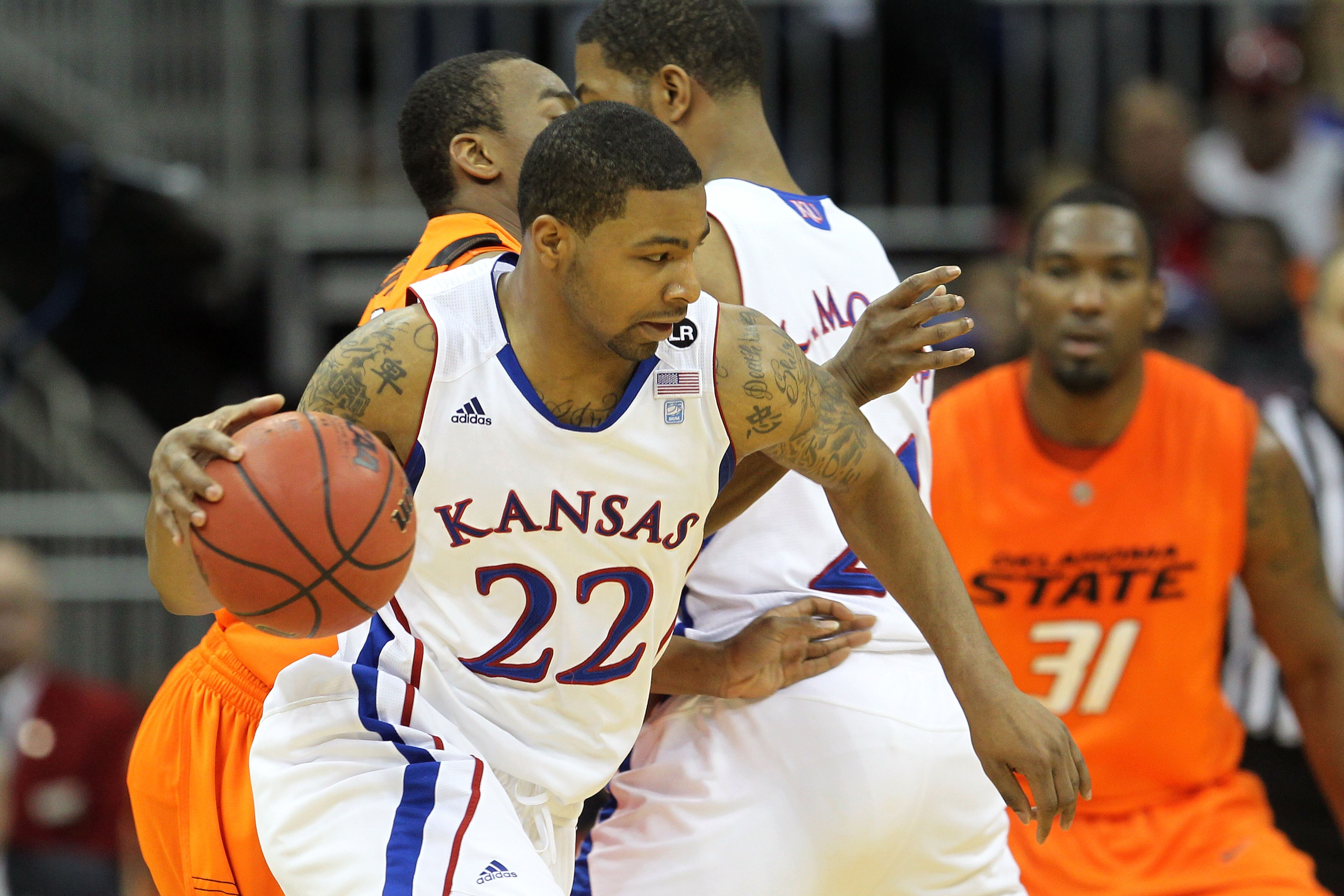 KANSAS CITY, MO - MARCH 10:  Marcus Morris #22 of the Kansas Jayhawks drives with the ball against the Oklahoma State Cowboys during their quarterfinal game in the 2011 Phillips 66 Big 12 Men's Basketball Tournament at Sprint Center on March 10, 2011 in K