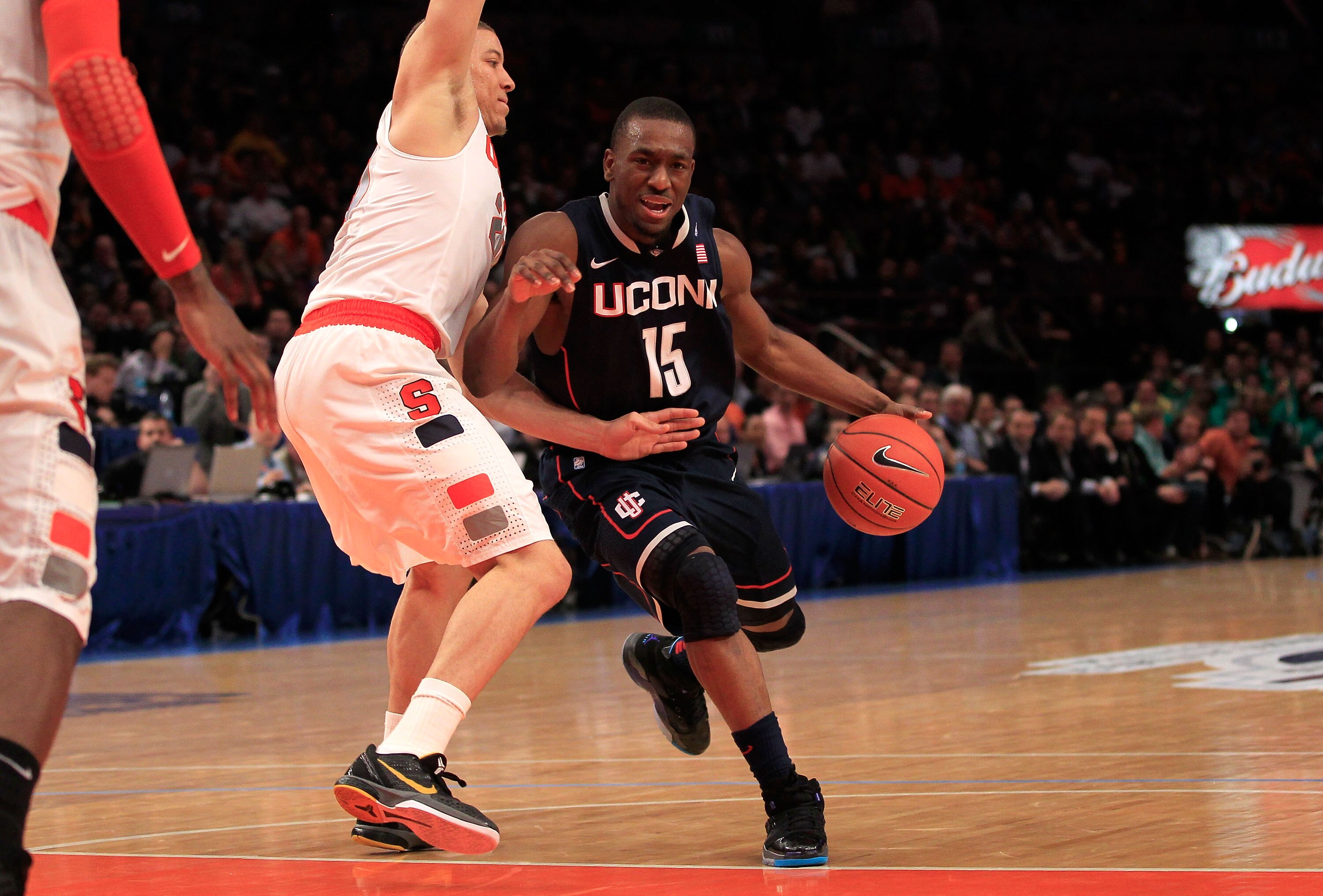 NEW YORK, NY - MARCH 11: Kemba Walker #15 of the Connecticut Huskies drives with the ball against Brandon Triche #20 of the Syracuse Orange during the semifinals of the 2011 Big East Men's Basketball Tournament presented by American Eagle Outfitters at Ma