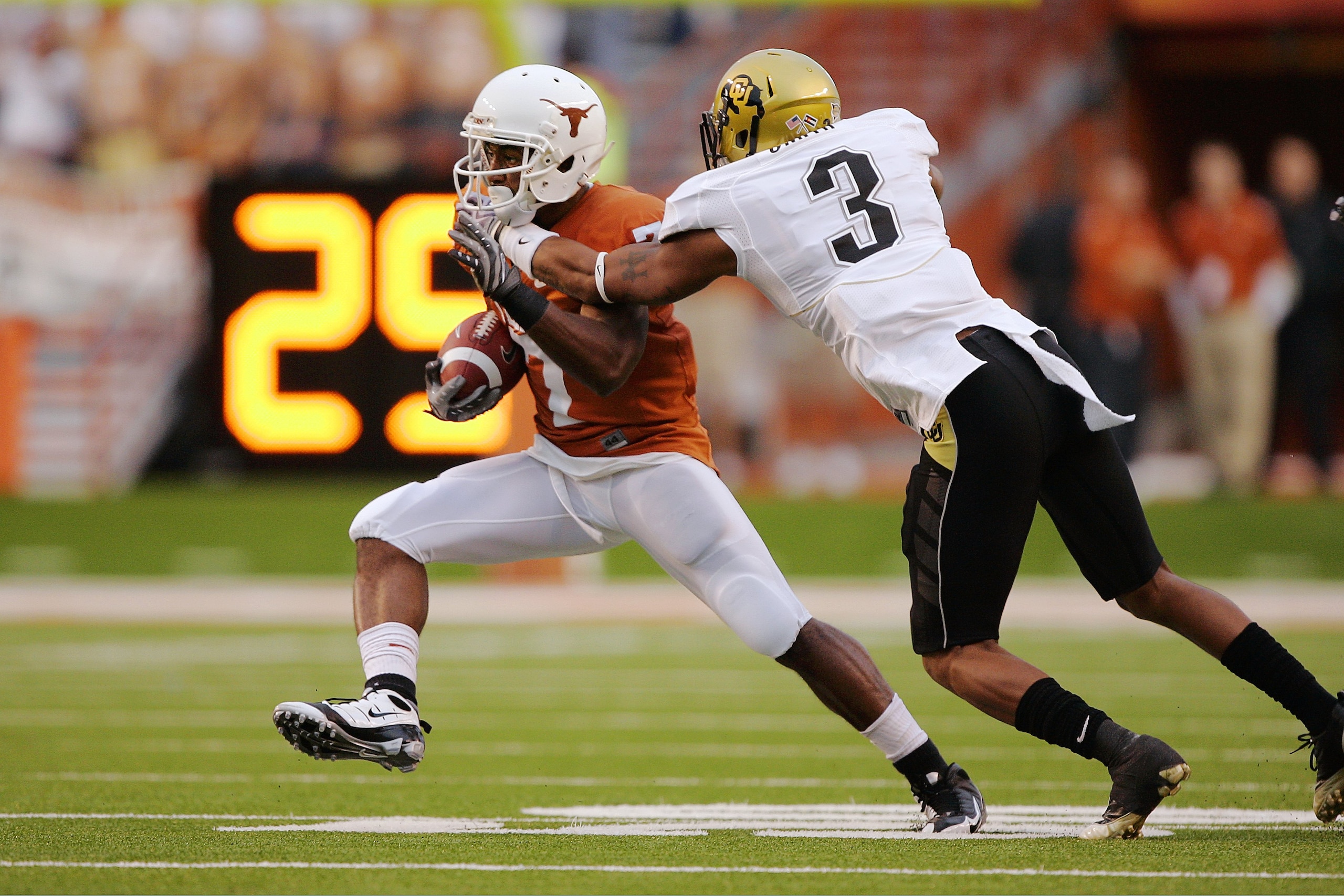 AUSTIN, TX - OCTOBER 10: Wide receiver John Chiles #7 of the Texas Longhorns makes a quick cut after catching a pass against cornerback Jimmy Smith #3 of the Colorado Buffaloes in the first quarter on October 10, 2009 at Darrell K Royal-Texas Memorial St AUSTIN, TX - OCTOBER 10: Wide receiver John Chiles #7 of the Texas Longhorns makes a quick cut after catching a pass against cornerback Jimmy Smith #3 of the Colorado Buffaloes in the first quarter on October 10, 2009 at Darrell K Royal-Texas Memorial St