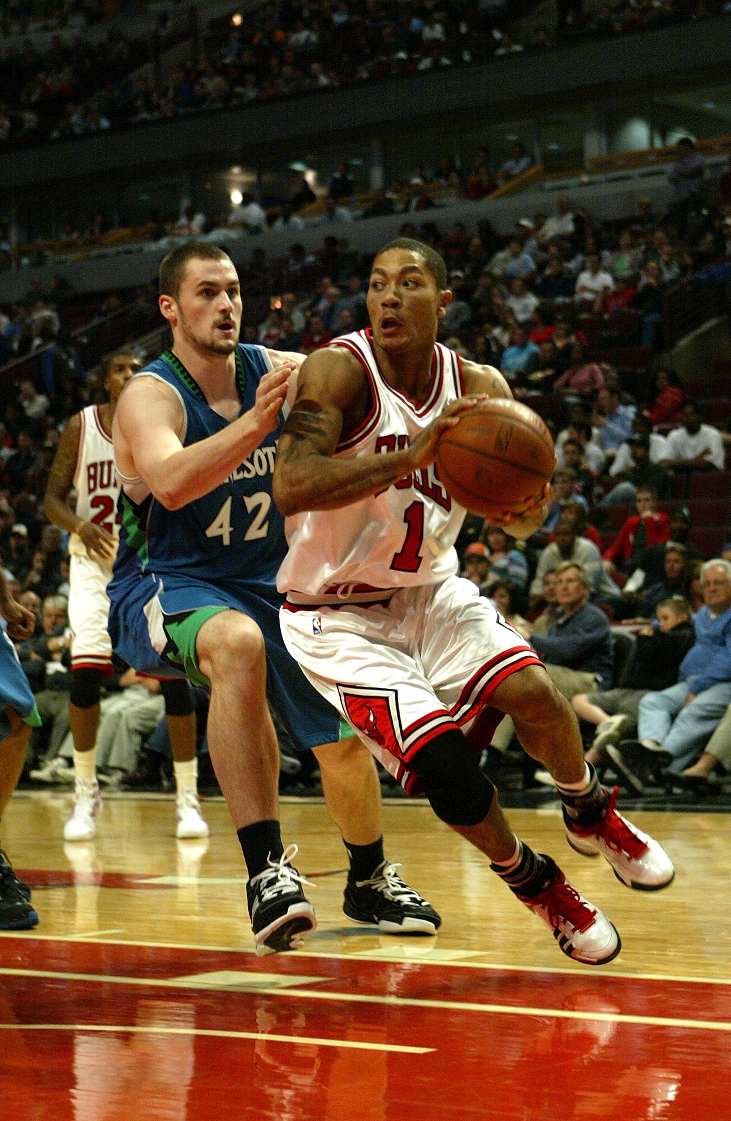 CHICAGO - OCTOBER 14:  Derrick Rose #1 of the Chicago Bulls drives against Kevin Love #42 of the Minnesota Timberwolves during their NBA preseson game at the United Center on October 14, 2008 in Chicago, Illinois. NOTE TO USER: User expressly acknowledges