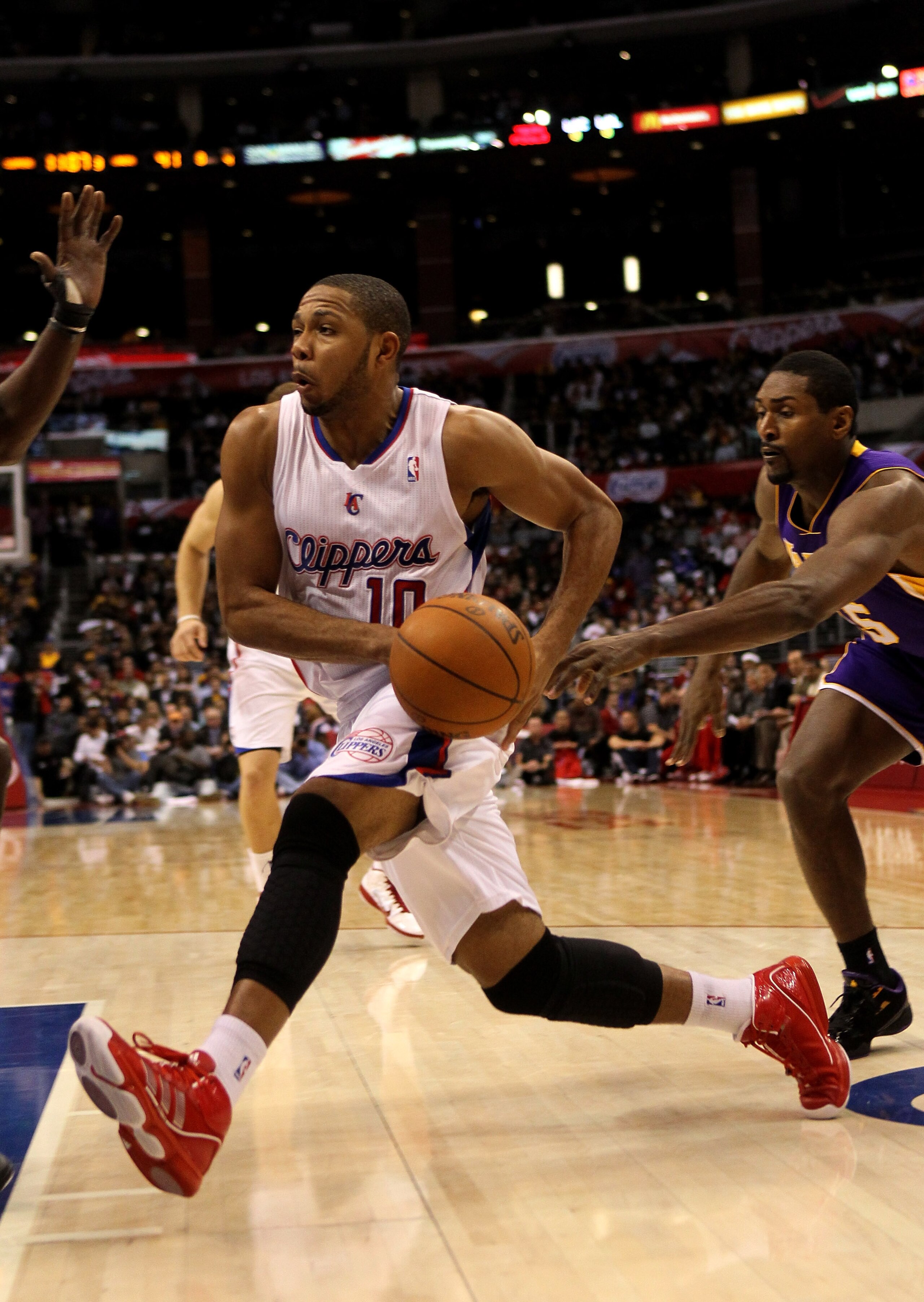 LOS ANGELES, CA - DECEMBER 08:  Eric Gordon #10 of the Los Angeles Clippers drives against the Los Angeles Lakers at Staples Center on December 8, 2010 in Los Angeles, California. The Lakers won 87-86.  NOTE TO USER: User expressly acknowledges and agrees