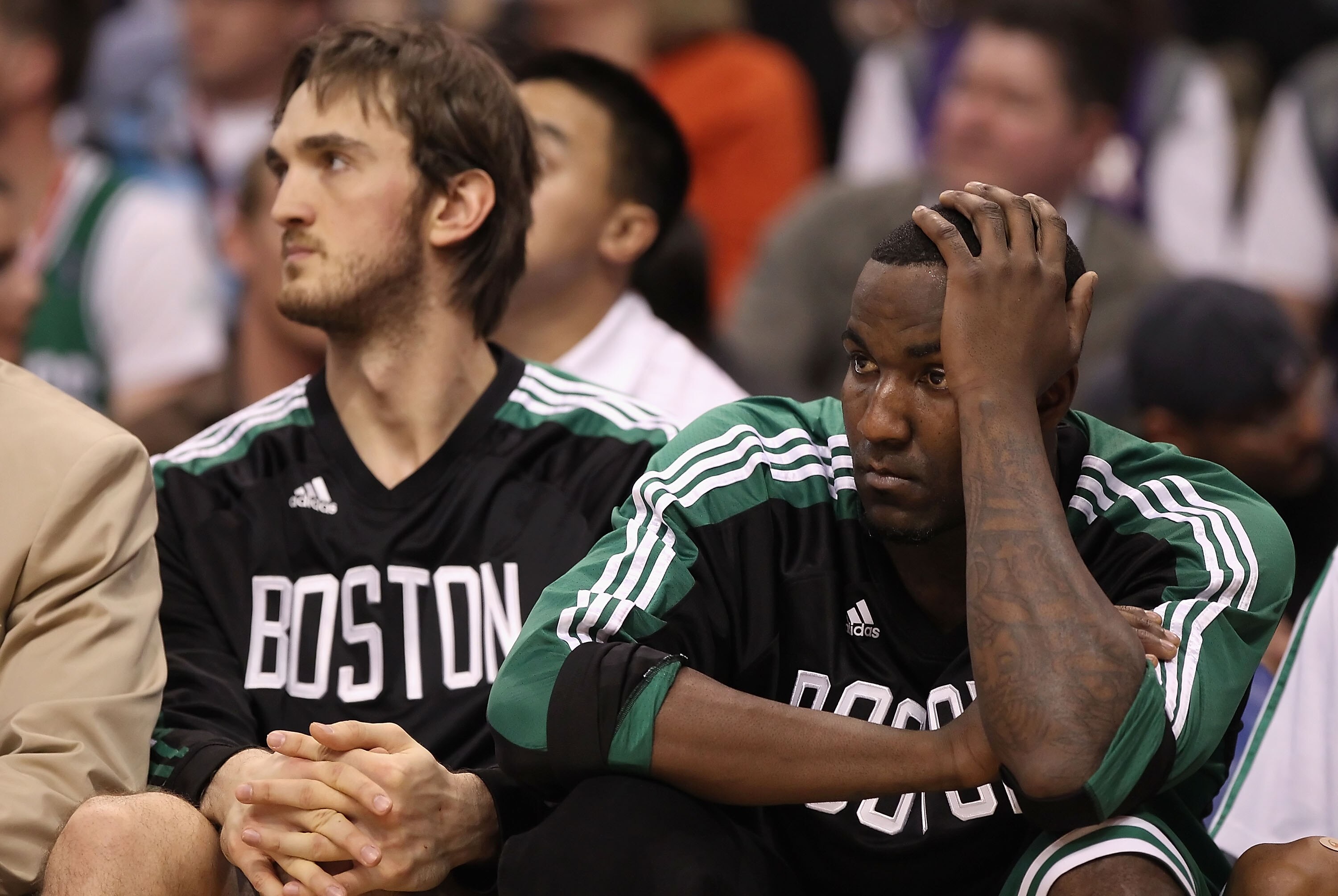 PHOENIX, AZ - JANUARY 28:  Kendrick Perkins #43  of the Boston Celtics reacts while sitting on the bench during the NBA game against the Phoenix Suns at US Airways Center on January 28, 2011 in Phoenix, Arizona. The Suns defeated the Celtics 88-71.  NOTE